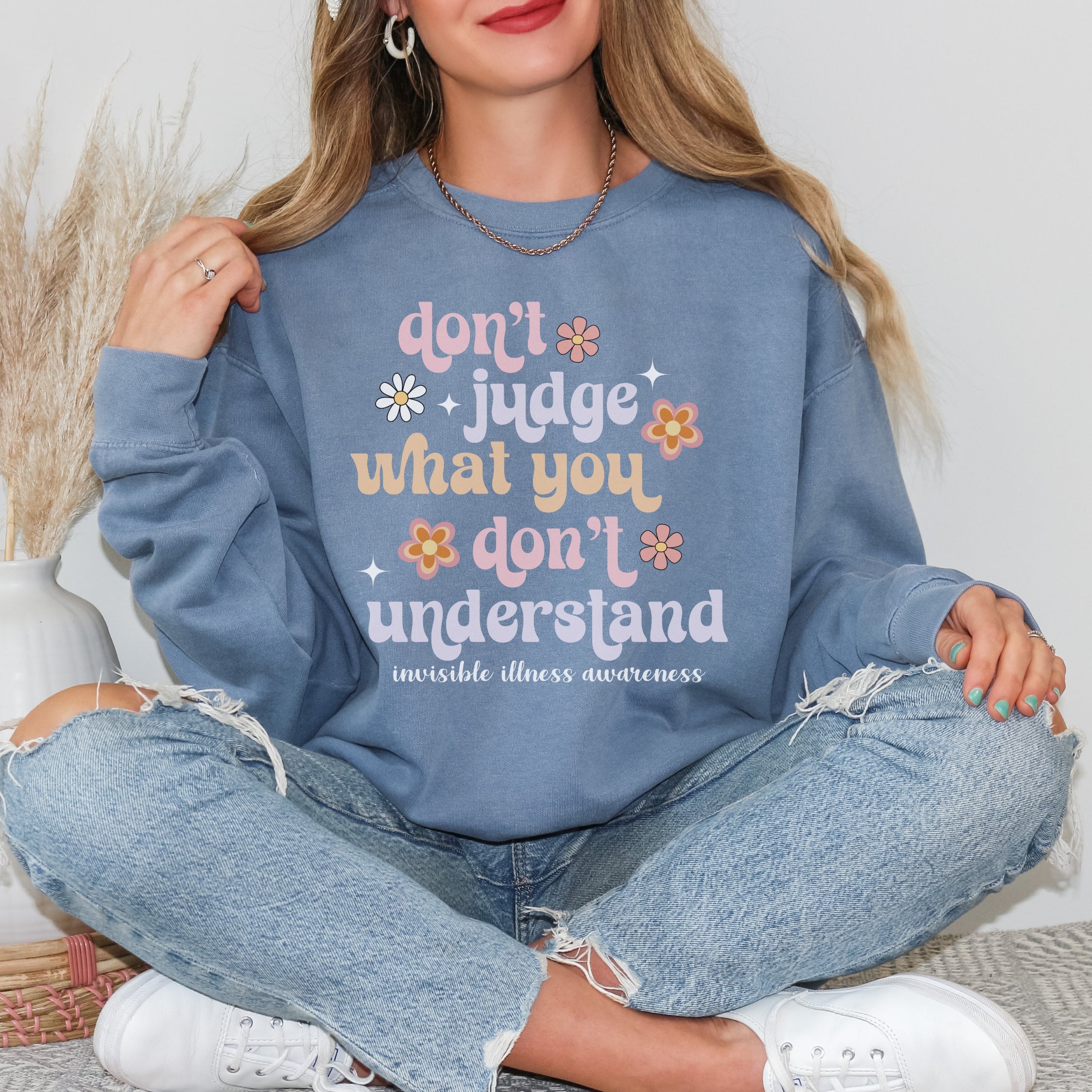 Girl wearing invisible illness Comfort Colors sweatshirt in blue jean