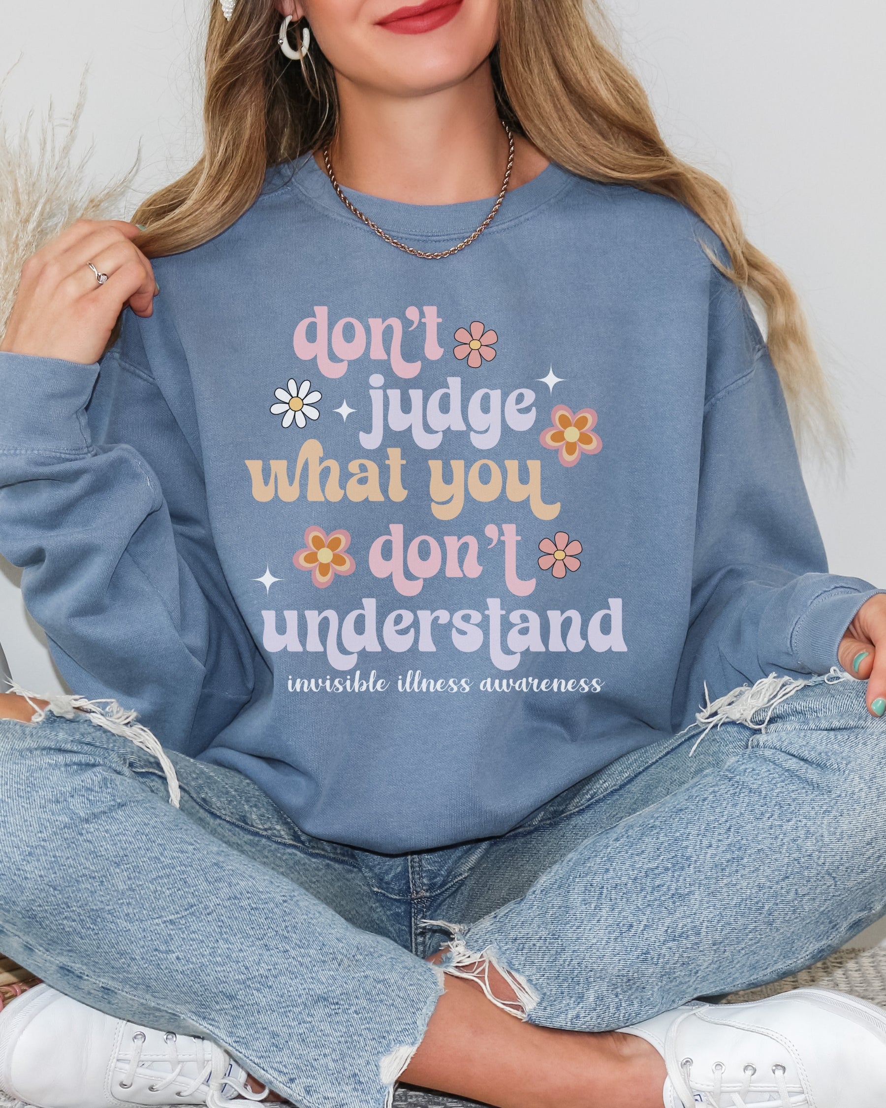 Girl wearing invisible illness Comfort Colors sweatshirt in blue jean