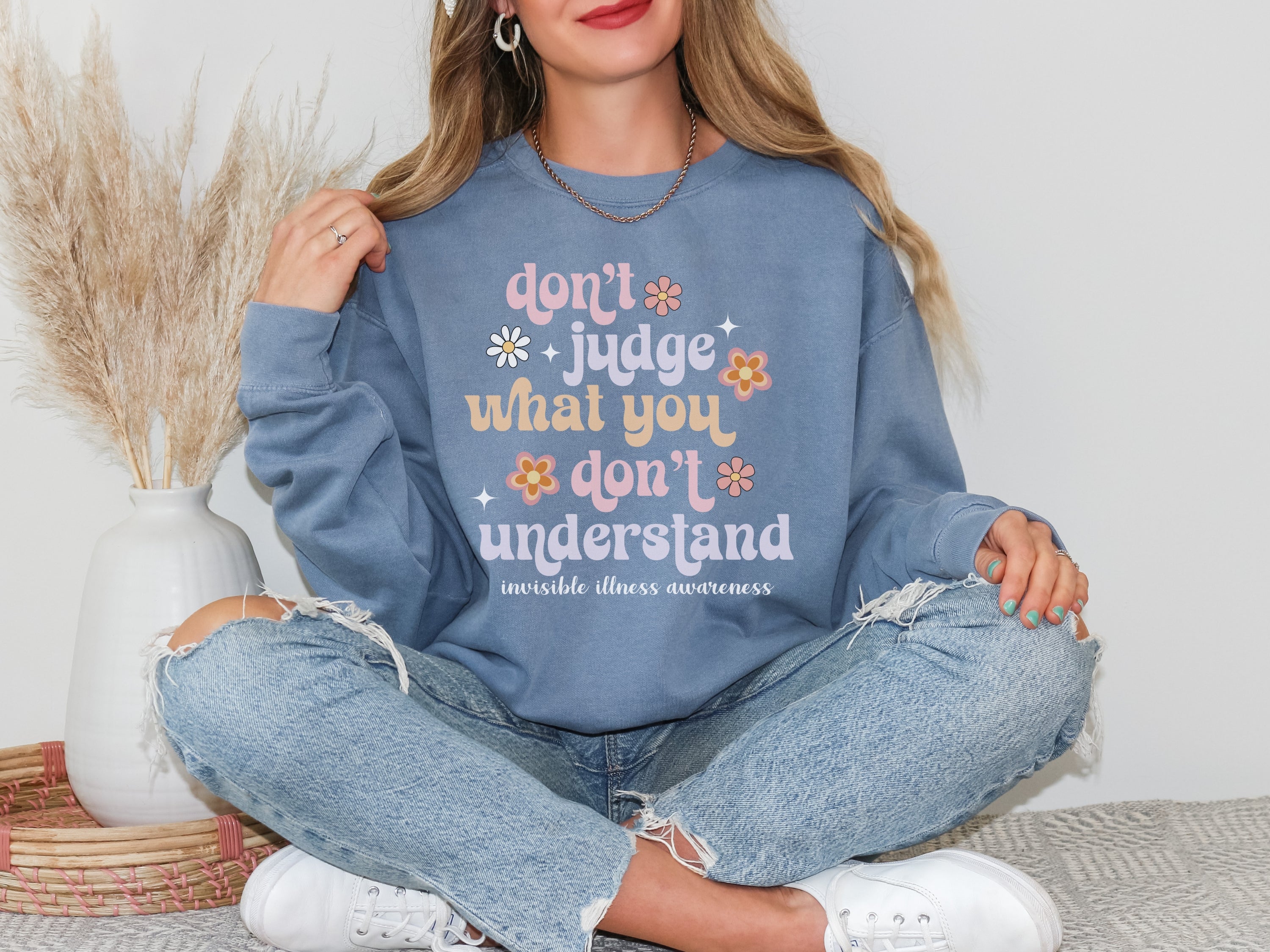 Girl wearing invisible illness Comfort Colors sweatshirt in blue jean