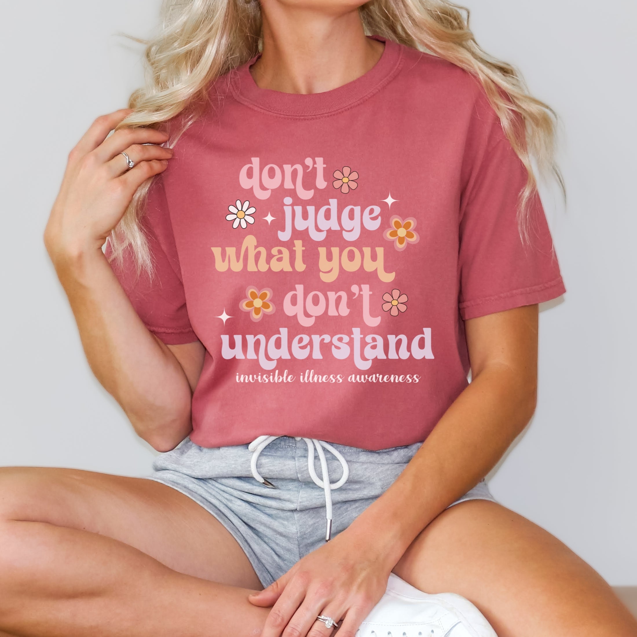 Girl wearing Comfort Colors invisible illness awareness shirt in cumin