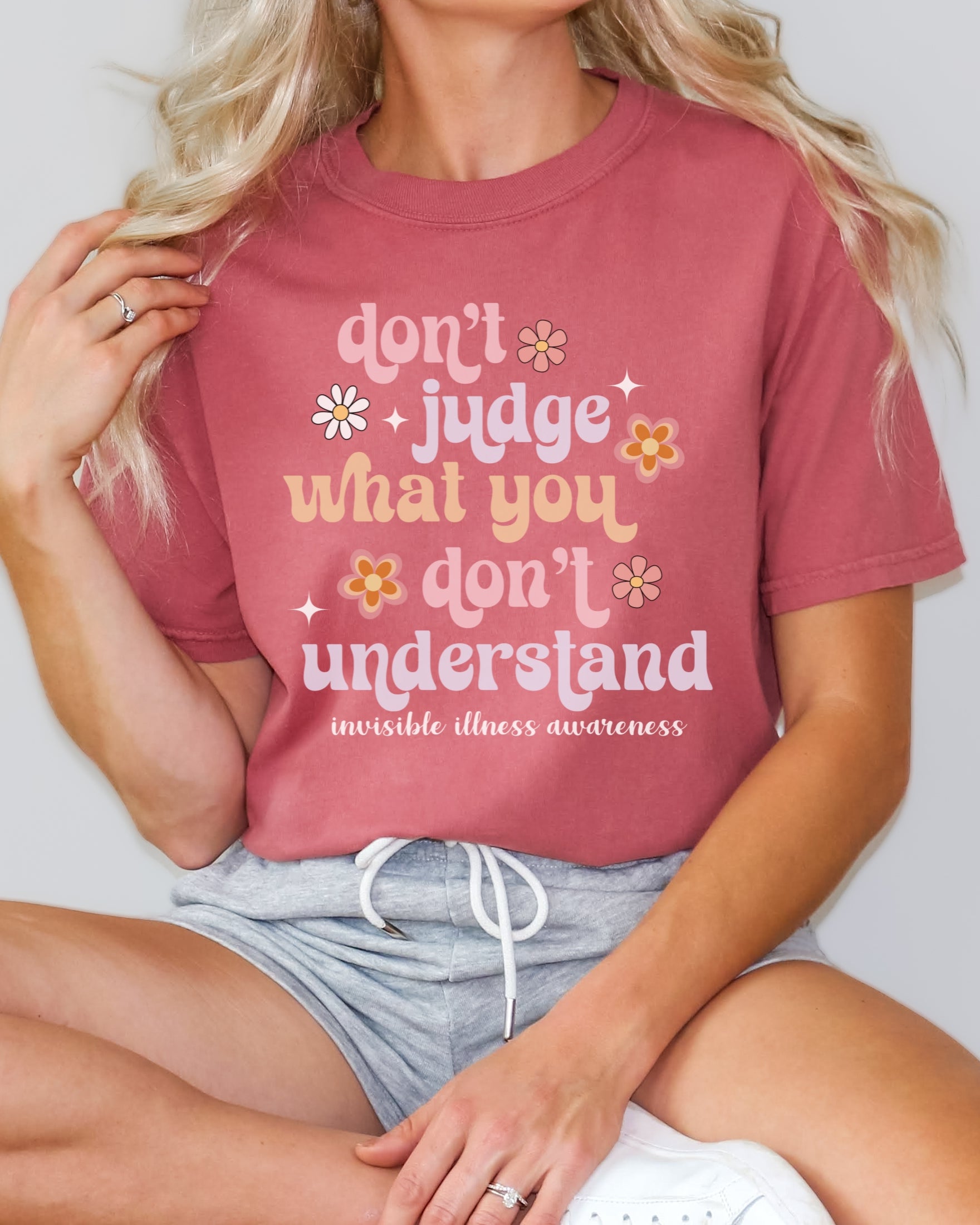 Girl wearing Comfort Colors invisible illness awareness shirt in cumin