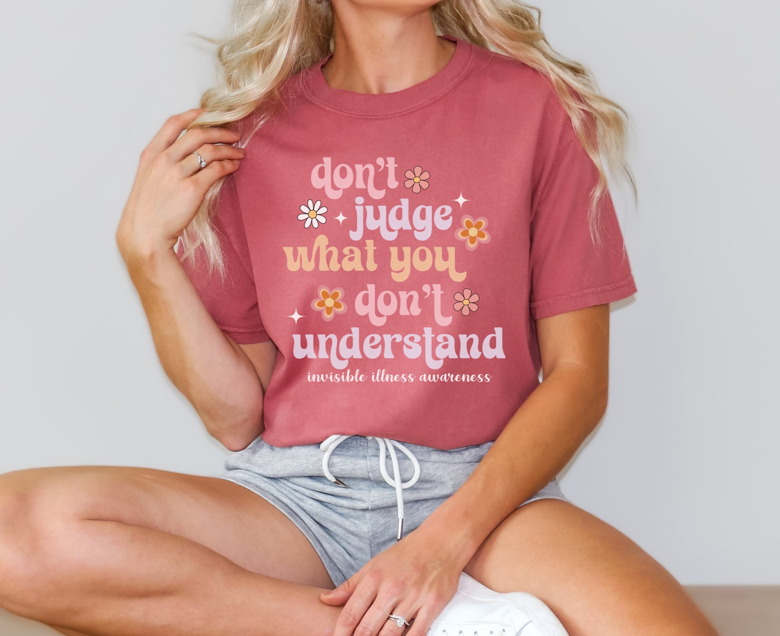 Girl wearing Comfort Colors invisible illness awareness shirt in cumin