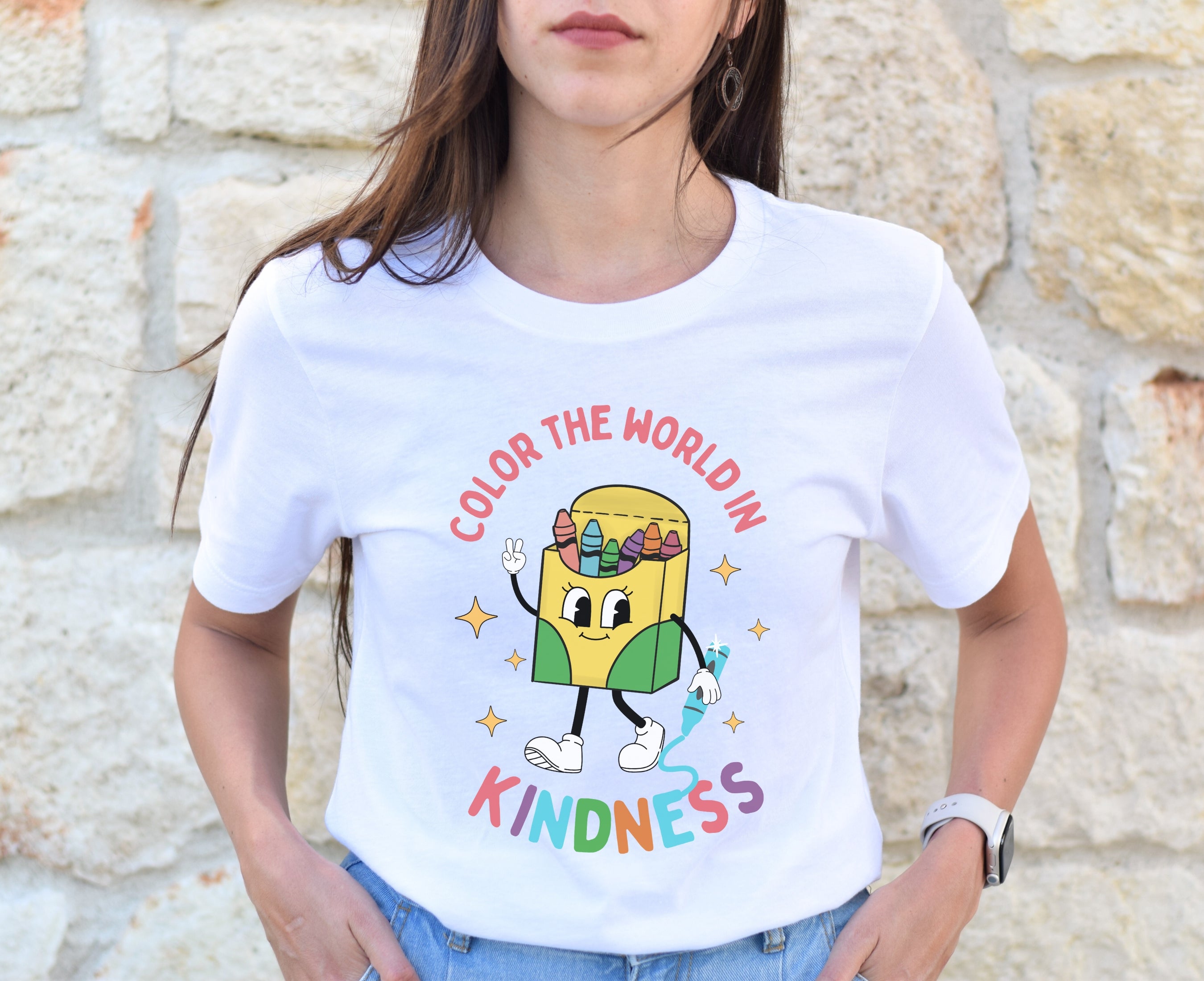 Teacher wearing white retro crayon box character kindness shirt
