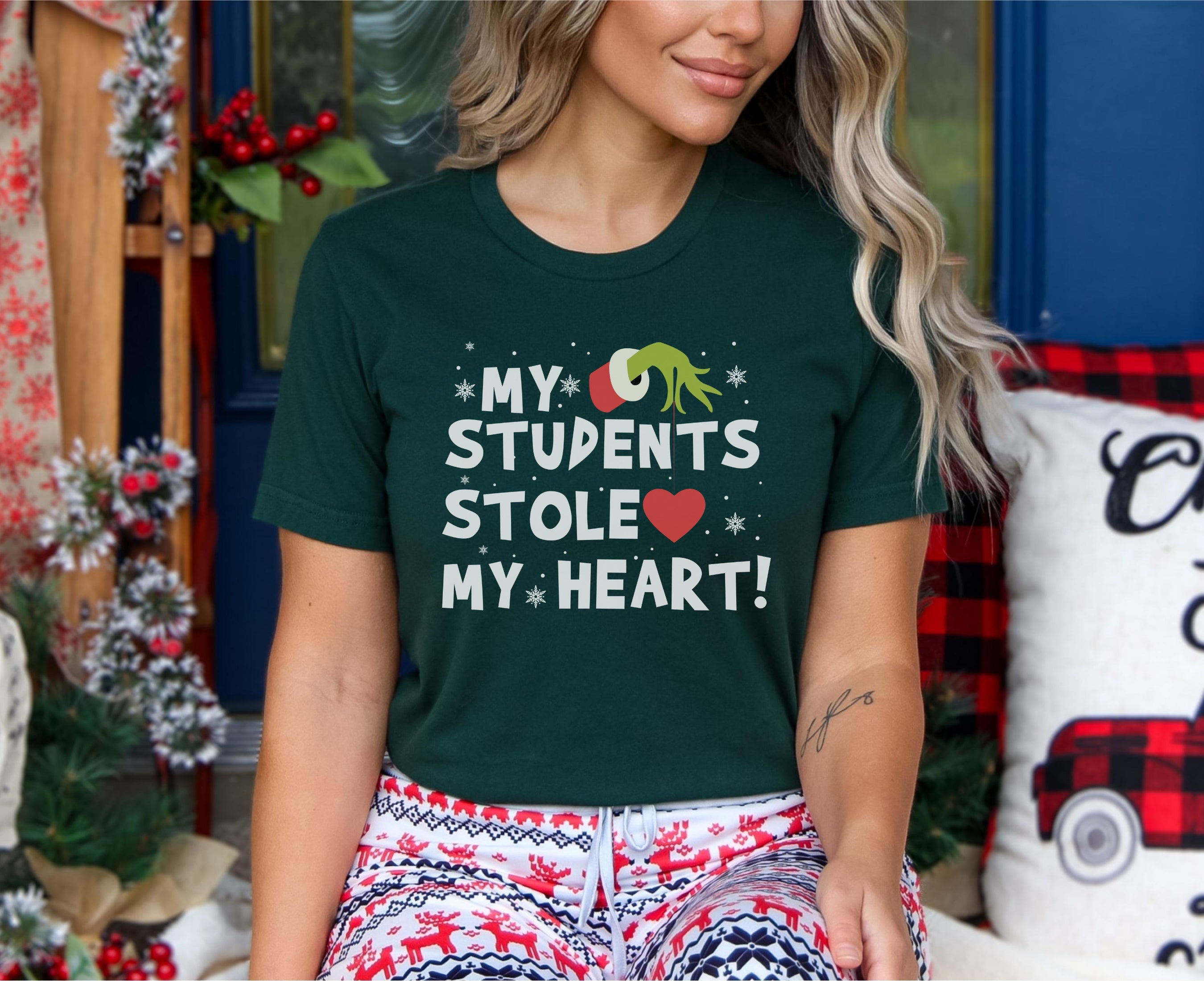 Woman wearing my students stole my heart t-shirt in forest green