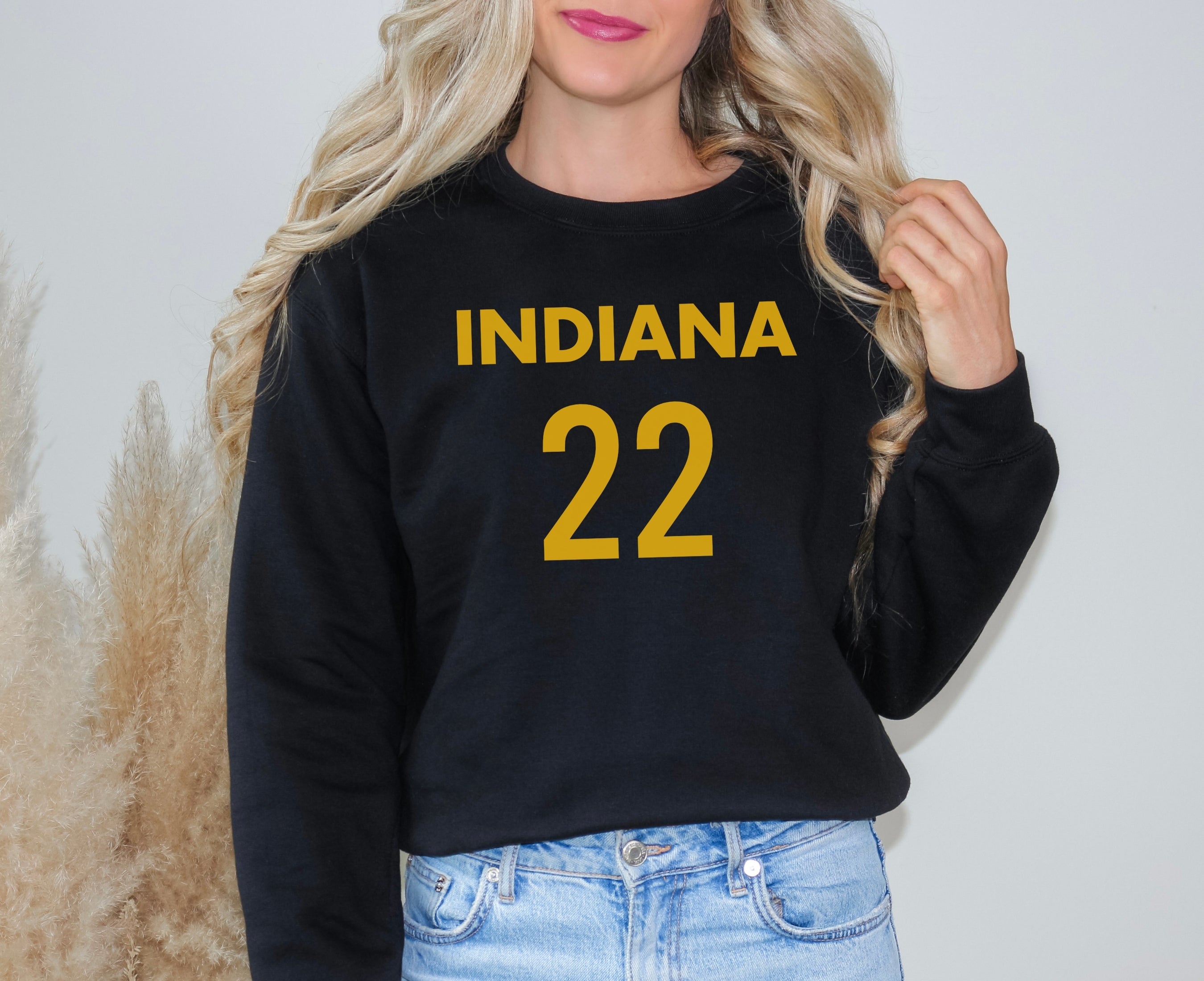 Girl wearing black Indiana 22 Caitlin Clark sweatshirt