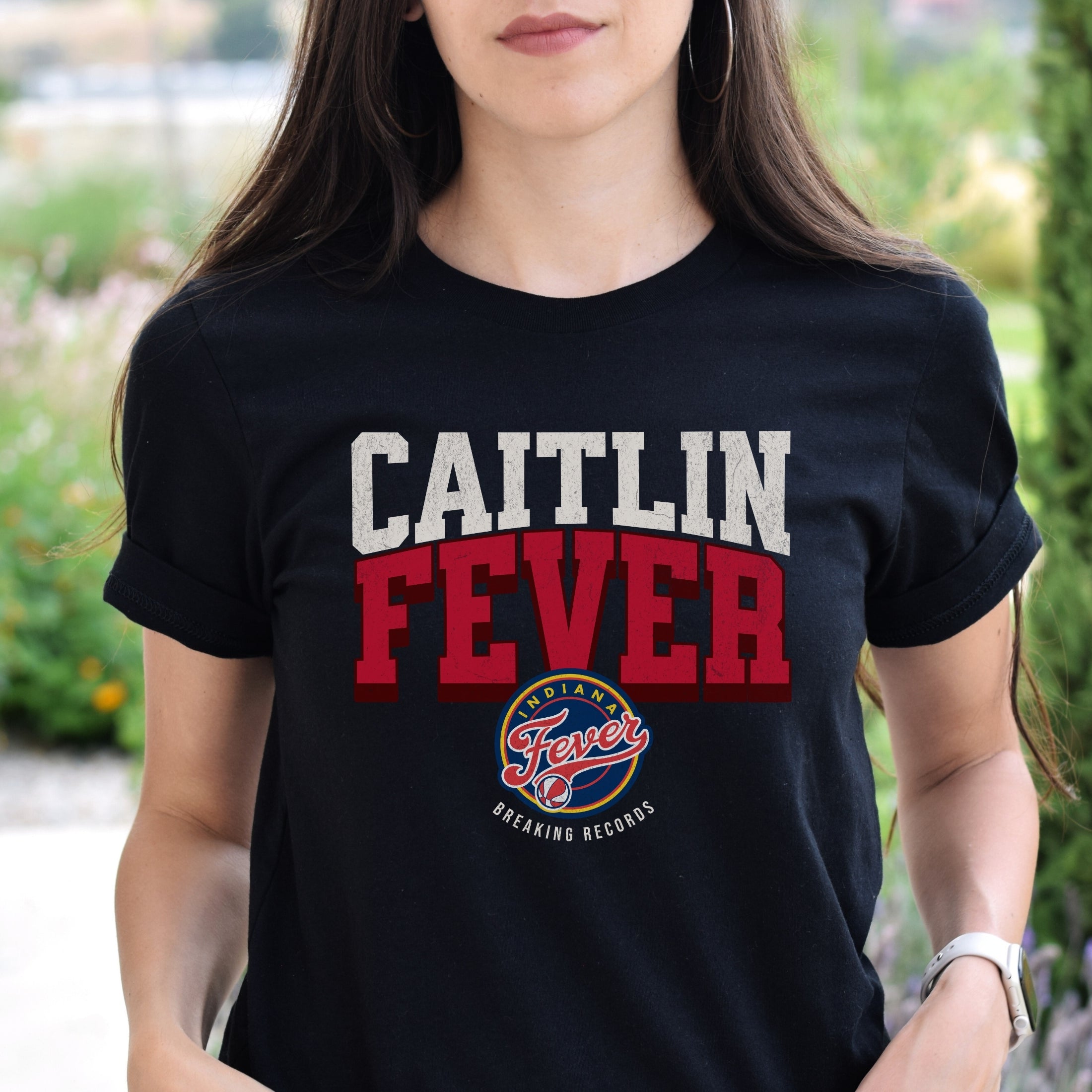 Woman wearing Black Caitlin Fever shirt