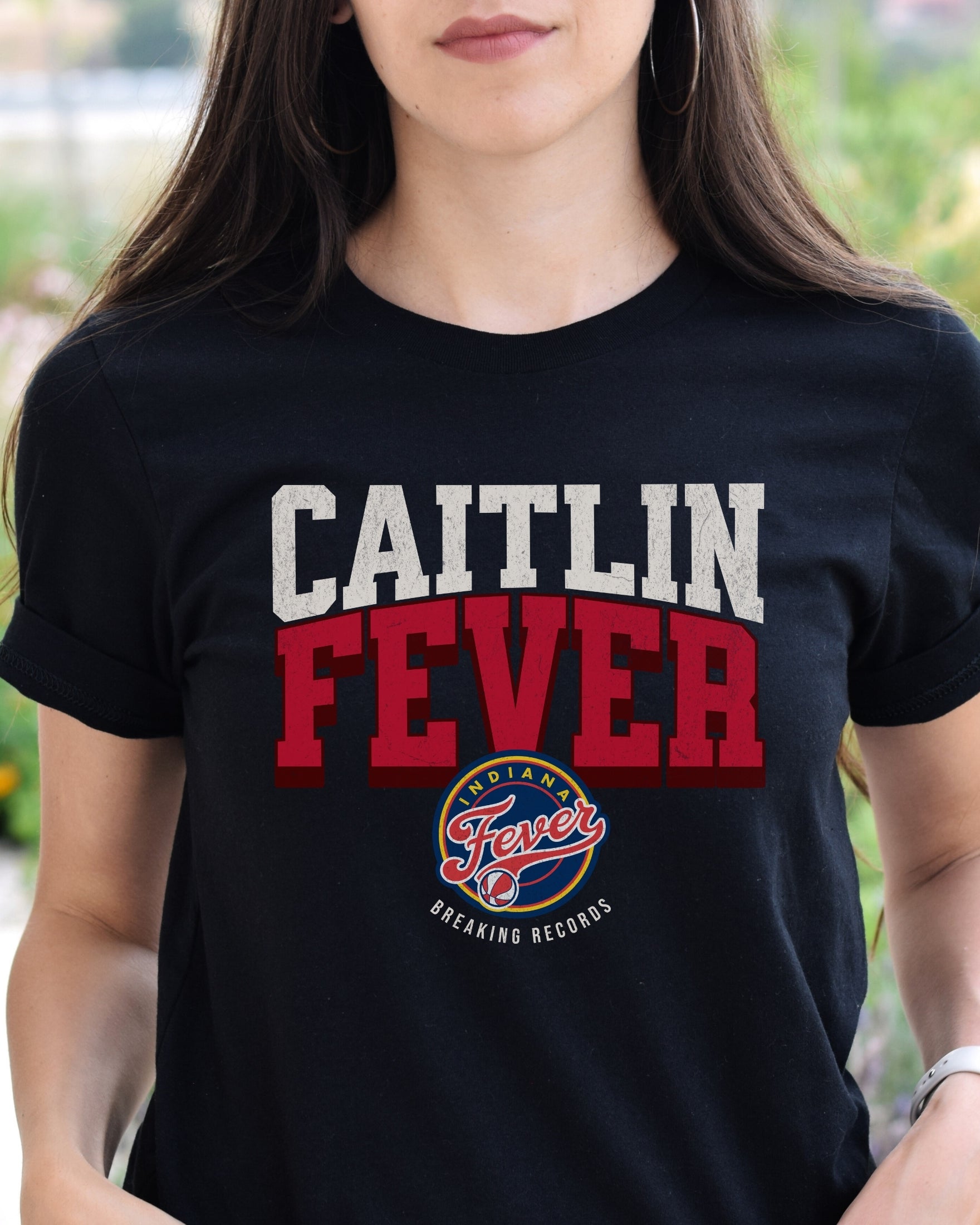 Woman wearing Black Caitlin Fever shirt