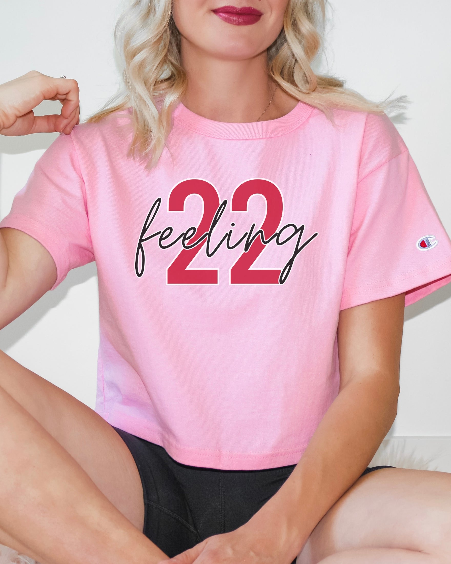 Girl wearing feeling 22 crop top in pink candy