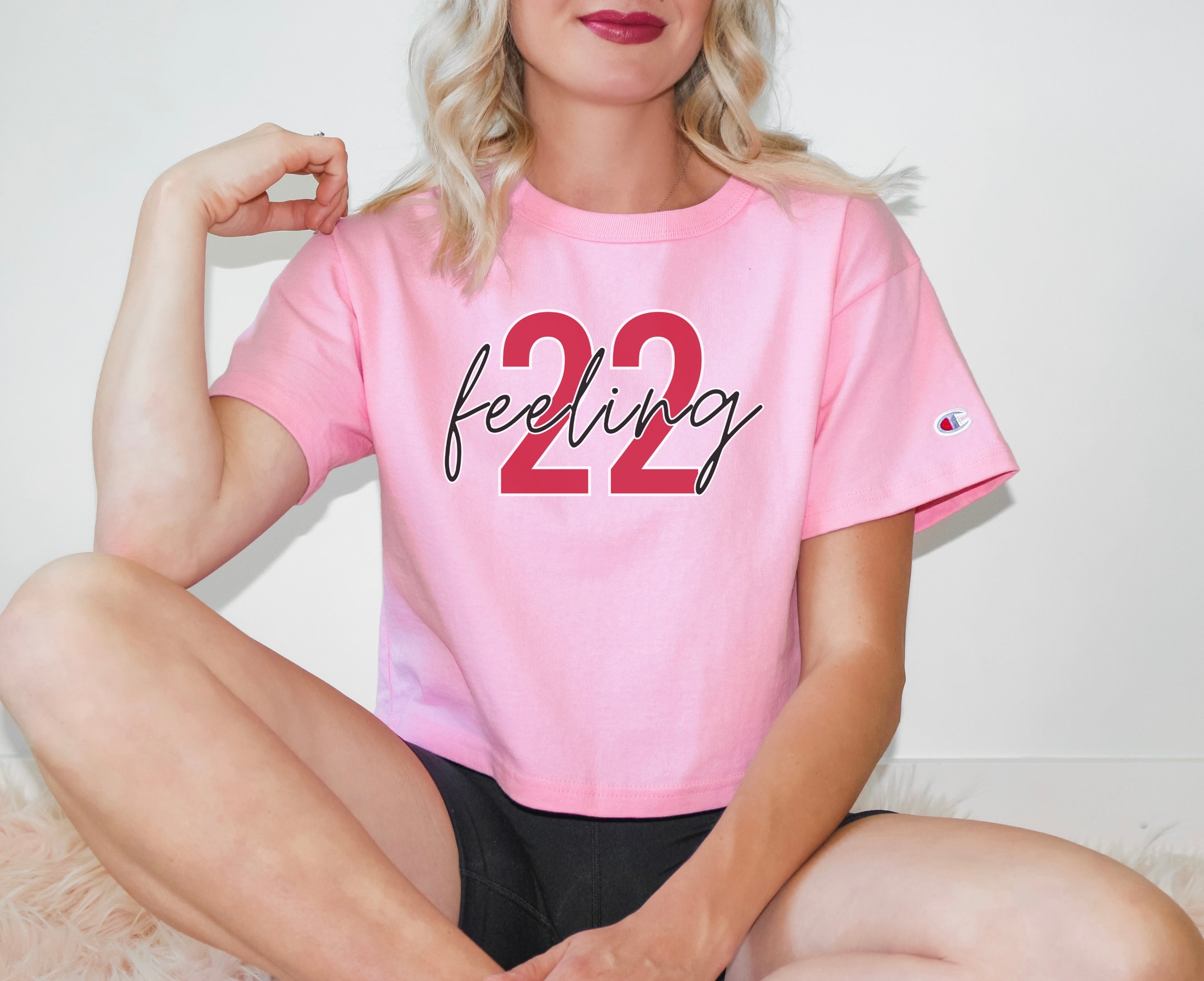 Girl wearing feeling 22 crop top in pink candy
