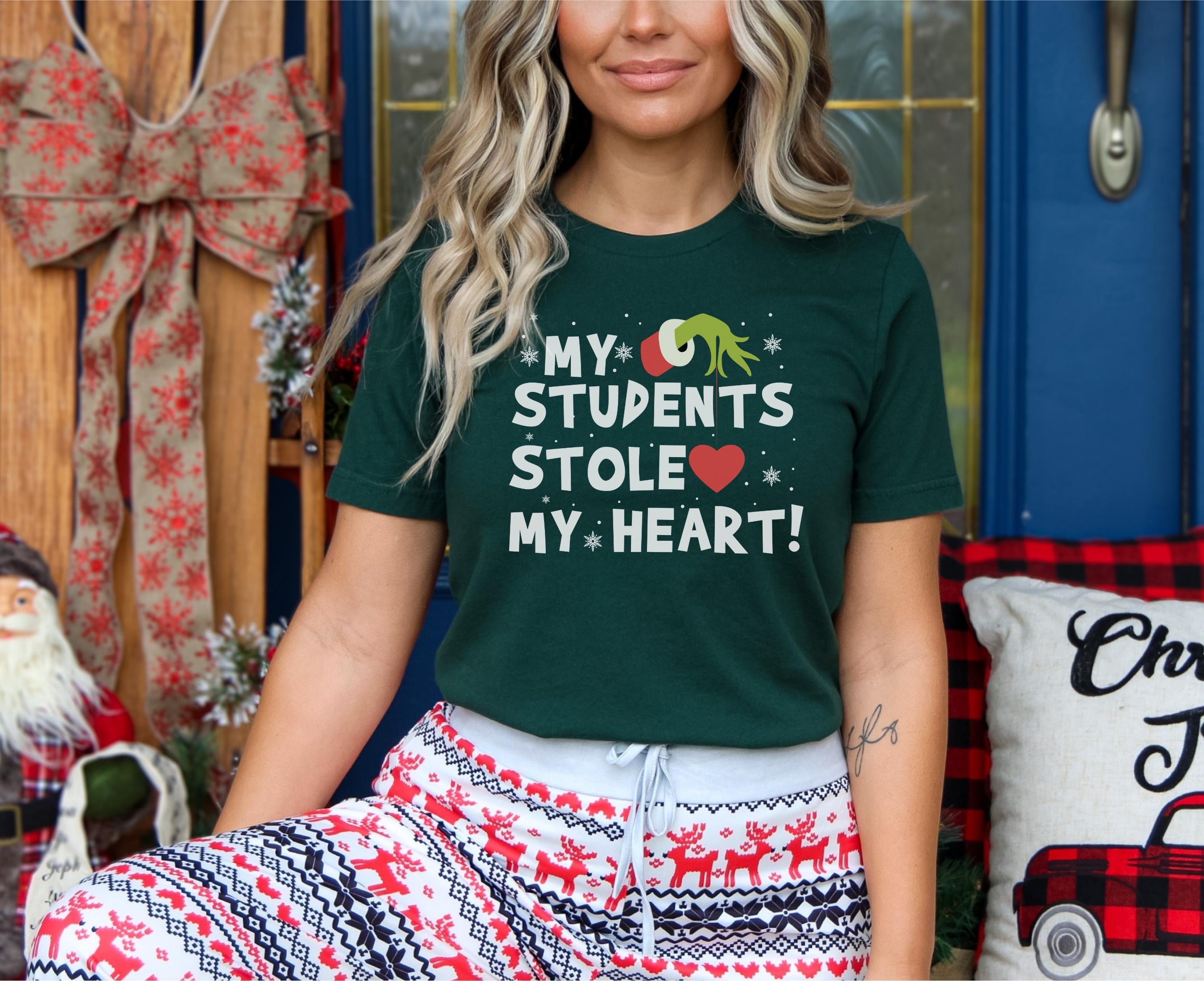 Teacher wearing my students stole my heart t-shirt in forest green