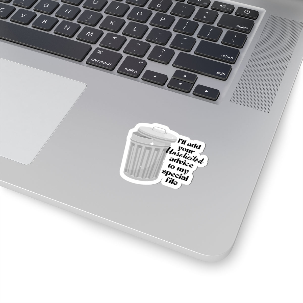 2 inch sticker of a trash can stuck on a laptop