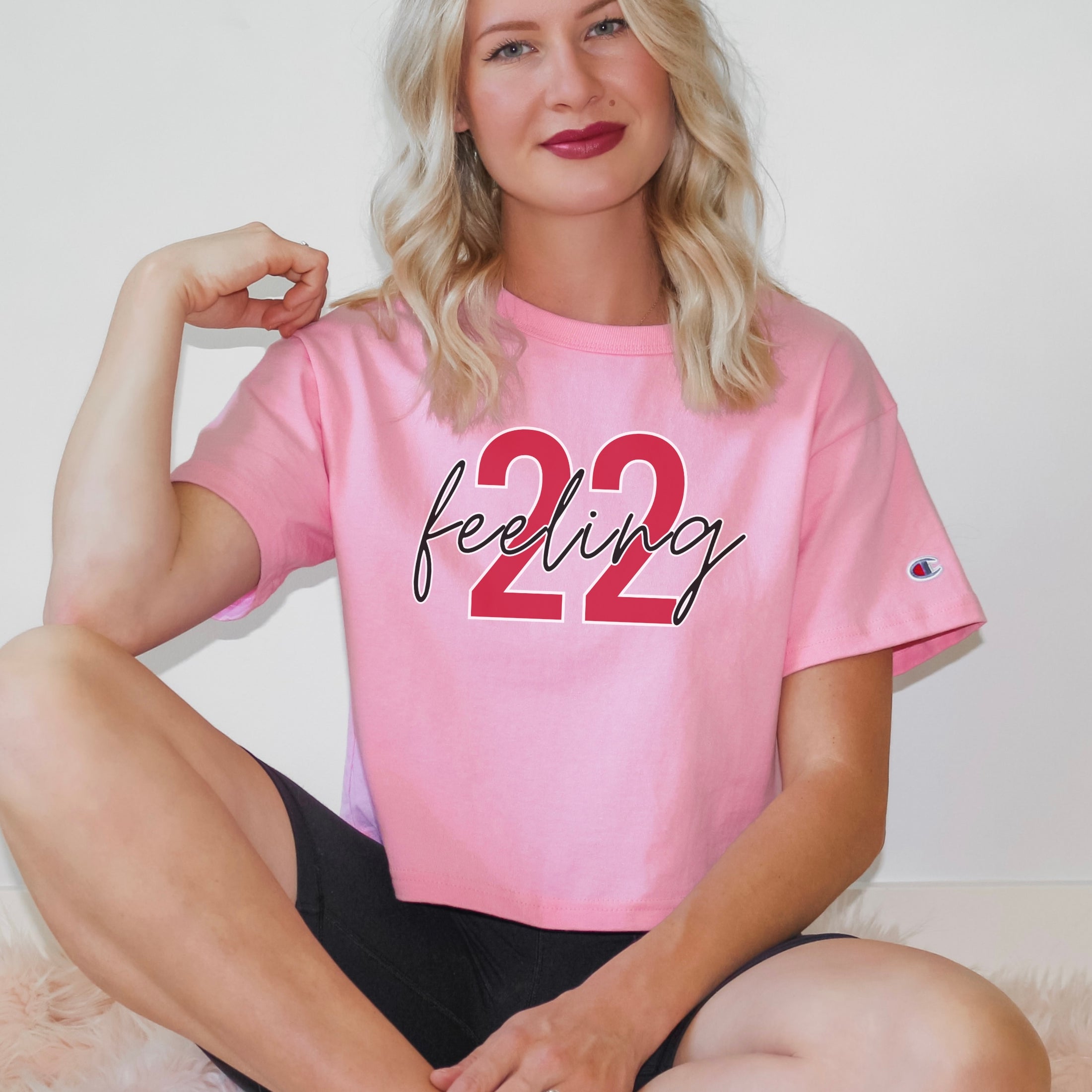 Girl wearing feeling 22 crop top in pink candy