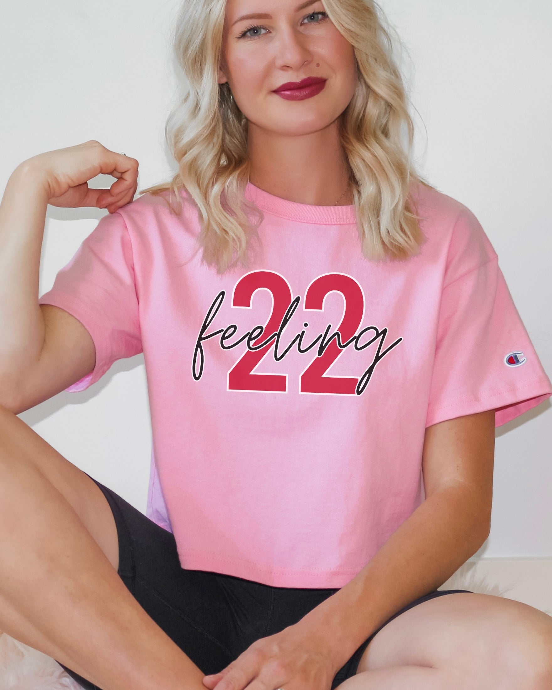 Girl wearing feeling 22 crop top in pink candy