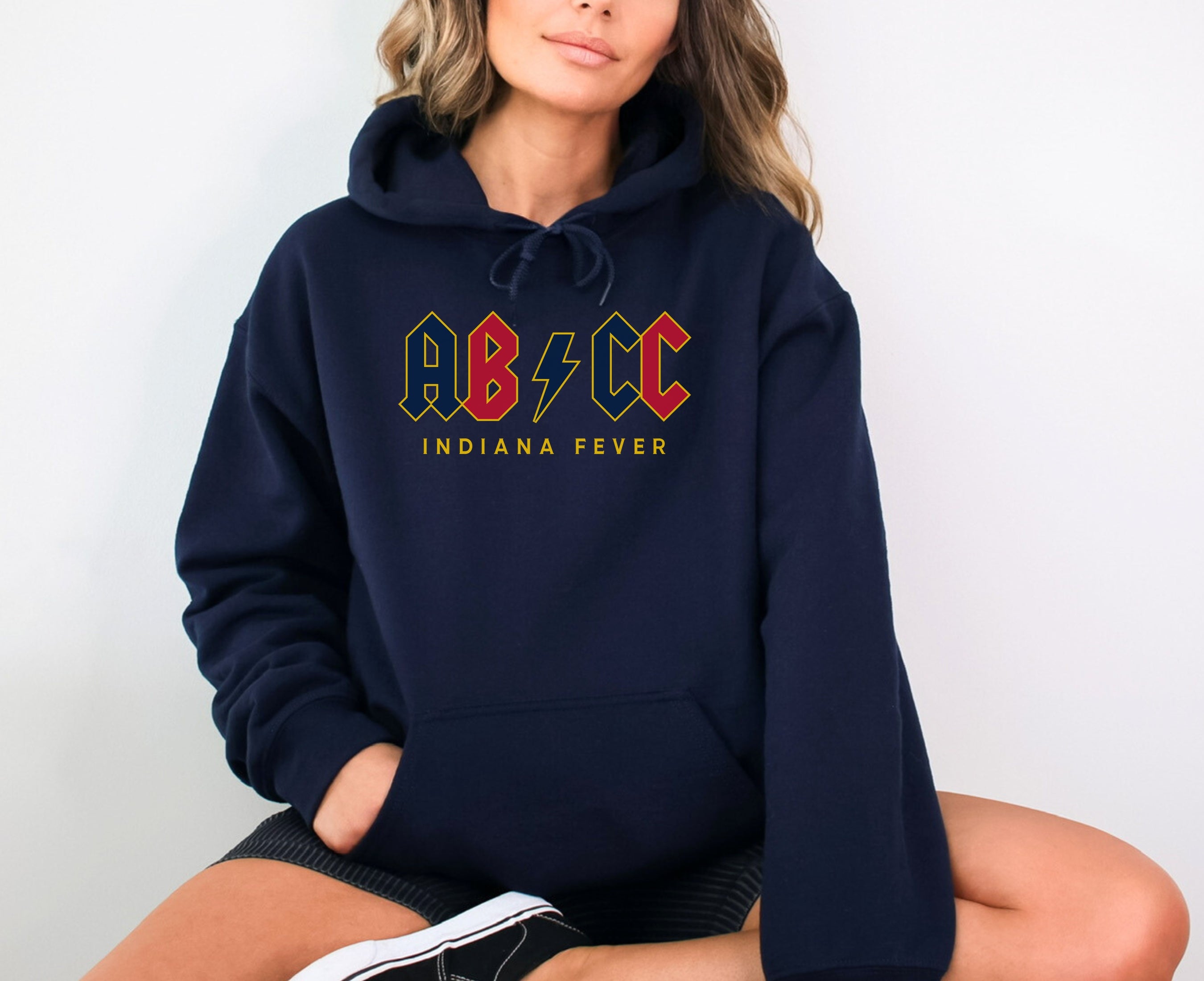Girl wearing navy Aliyah Boston Caitlin Clark hoodie
