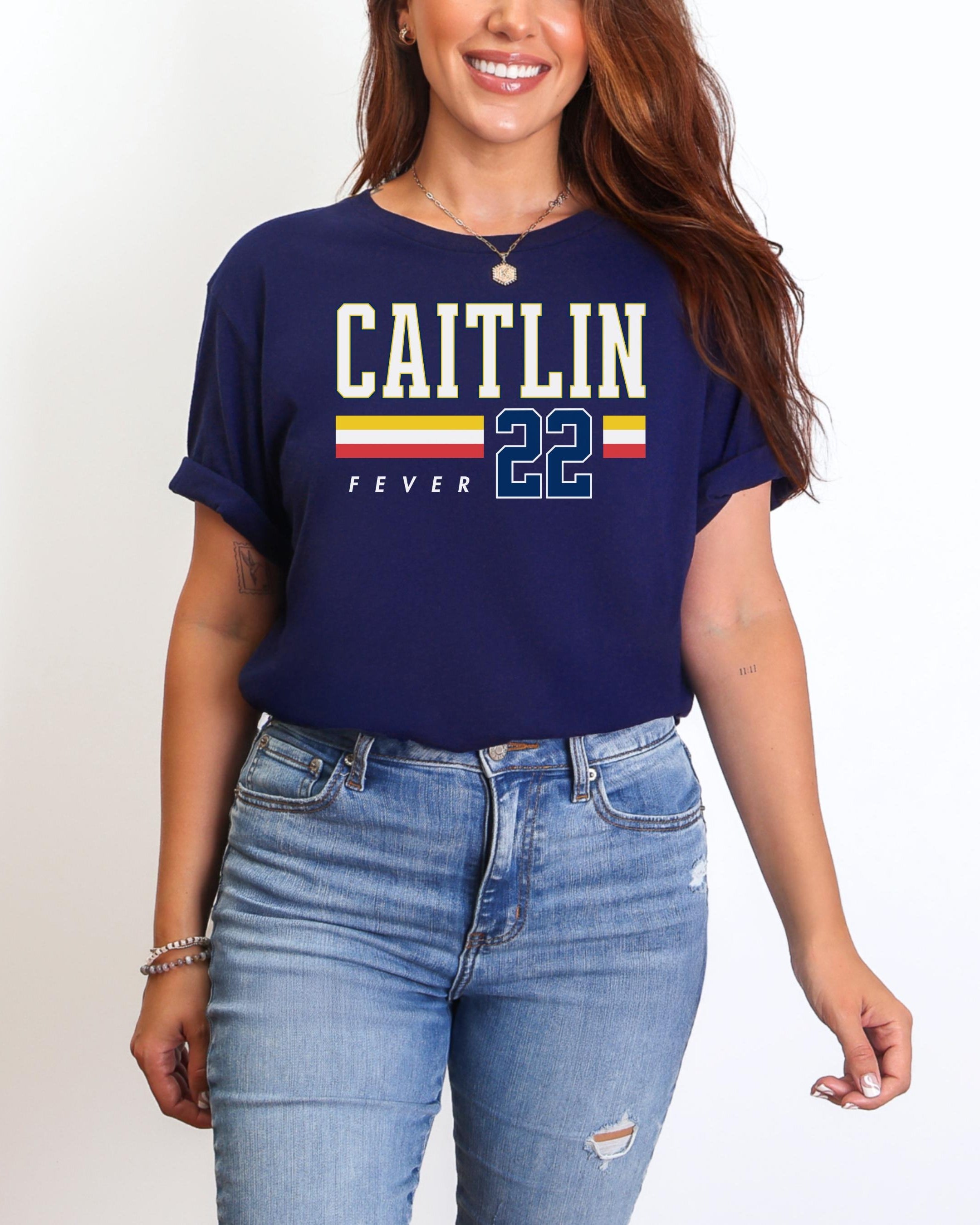 Person wearing t-shirt with 'CAITLIN FEVER' printed on it
