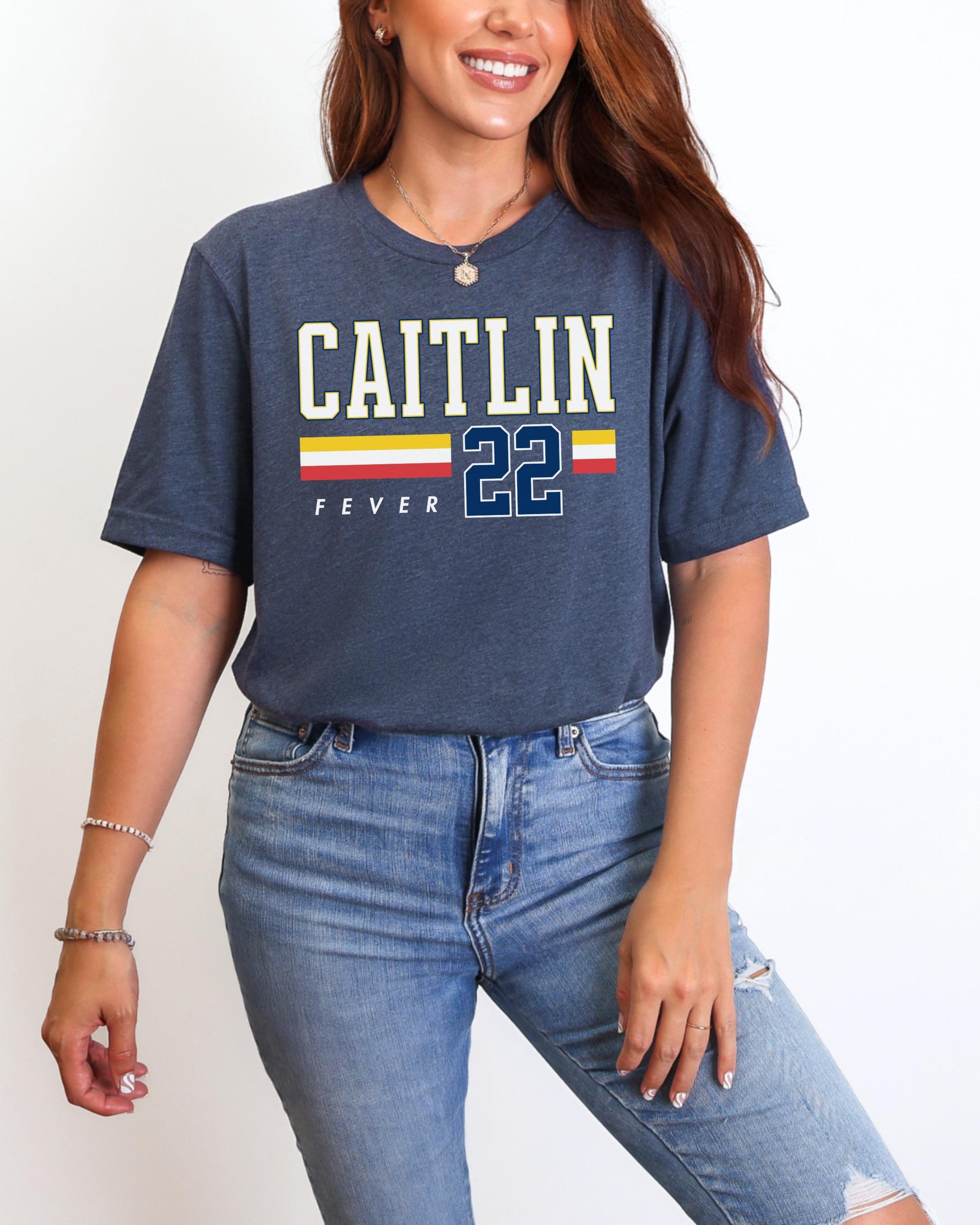 Person wearing t-shirt with 'CAITLIN FEVER' printed on it
