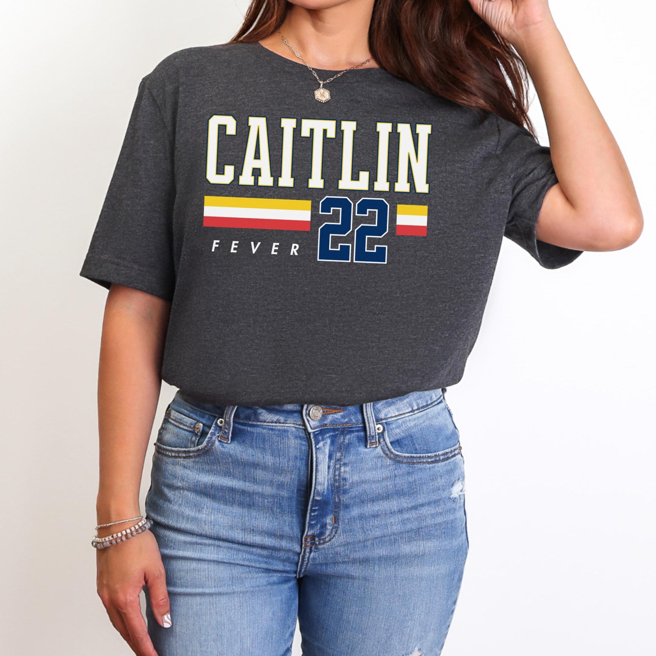 Person wearing t-shirt with 'CAITLIN FEVER' printed on it