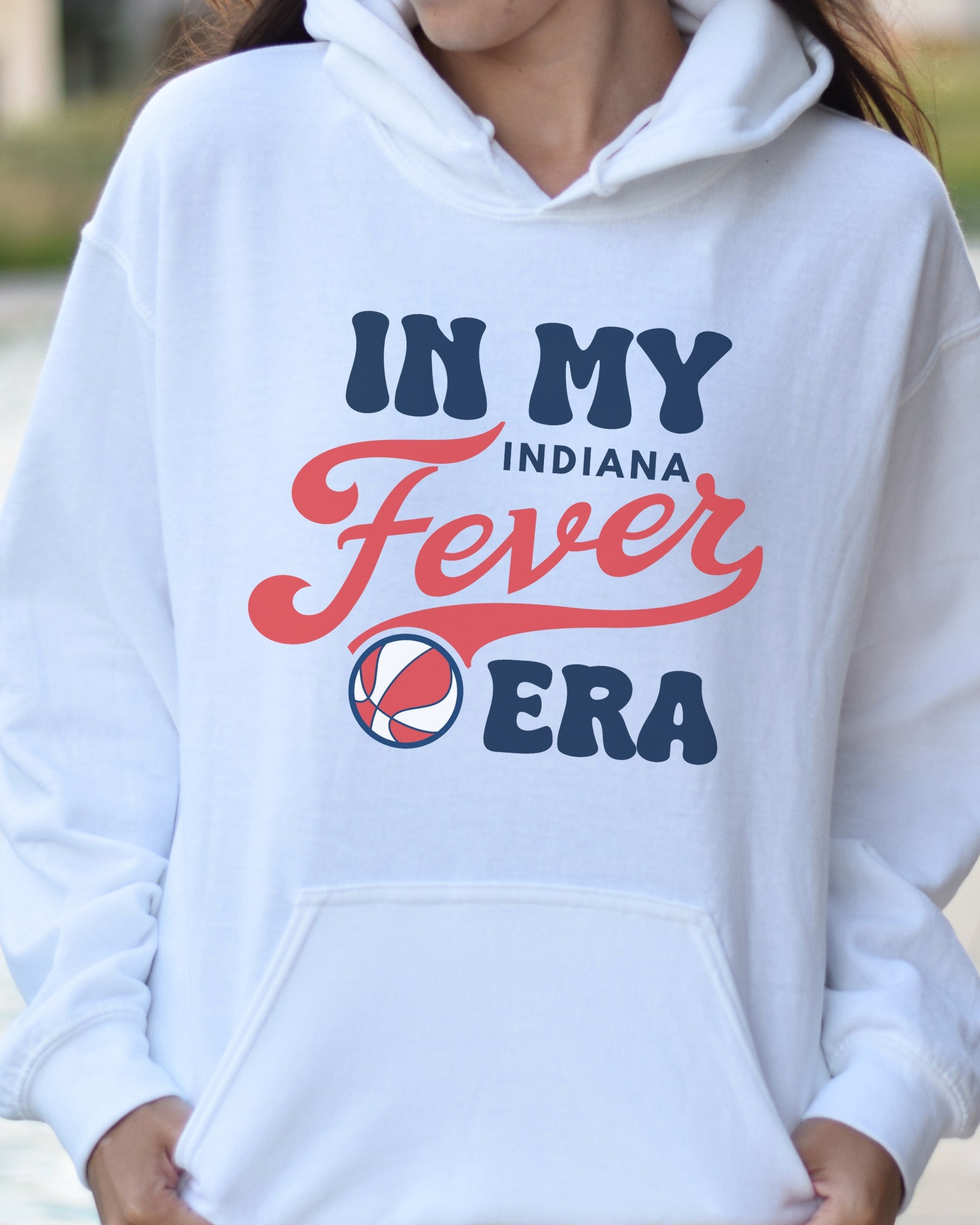 Girl wearing white in my Fever era hoodie