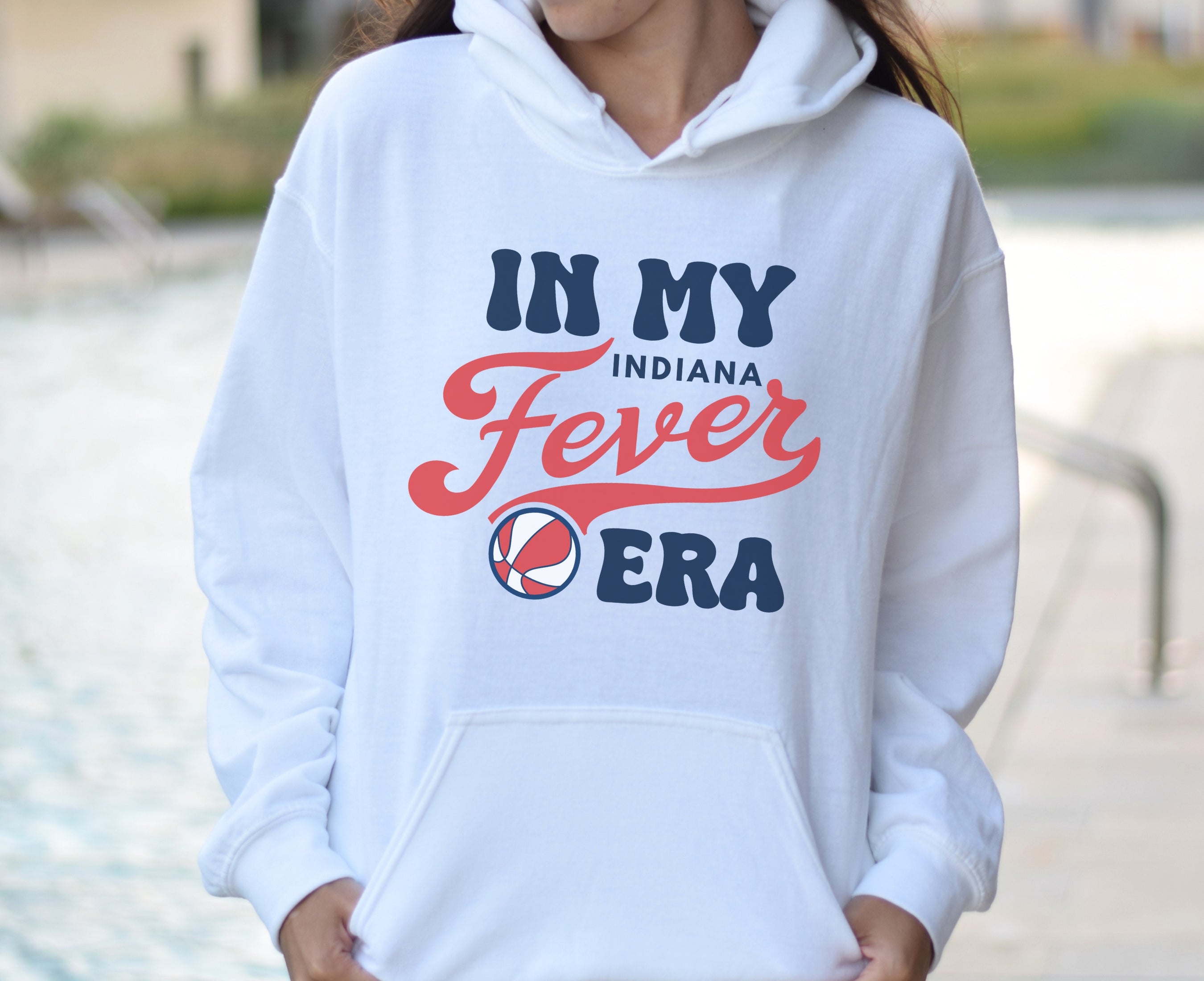 Girl wearing white in my Fever era hoodie