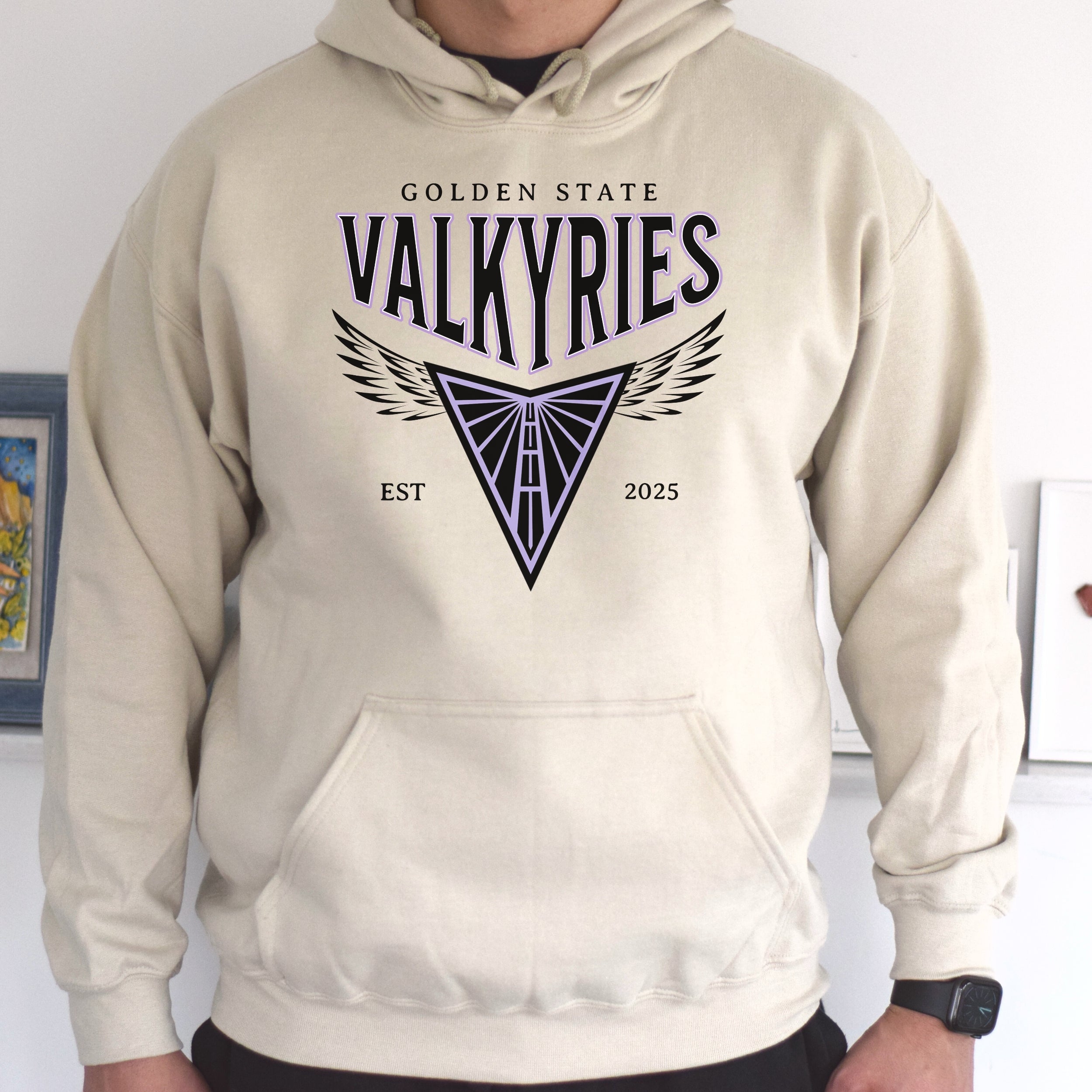 Beige hoodie with 'Golden State Valkyries' logo on a plain background