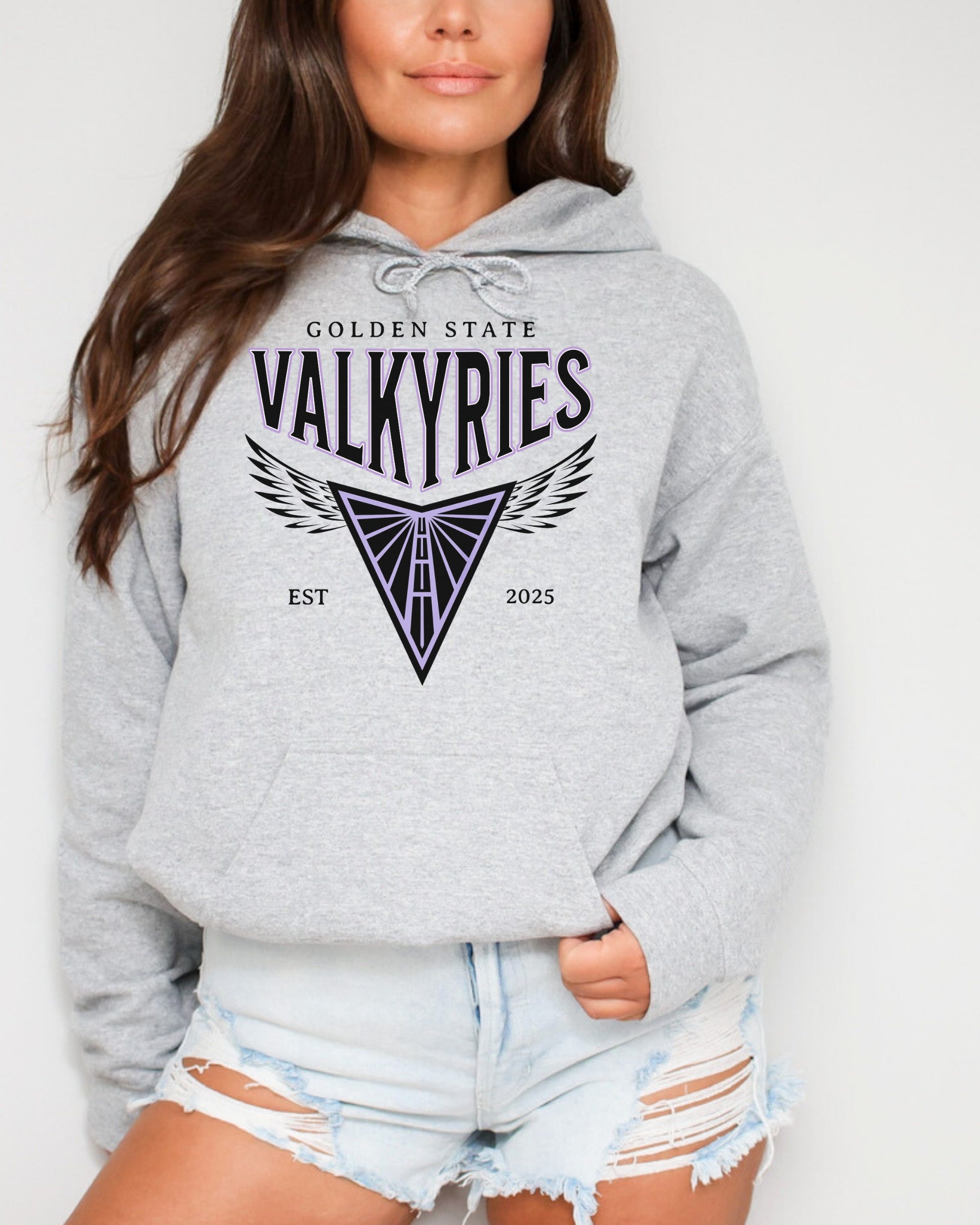 Person wearing a gray hoodie with 'Golden State Valkyries' logo on a plain background
