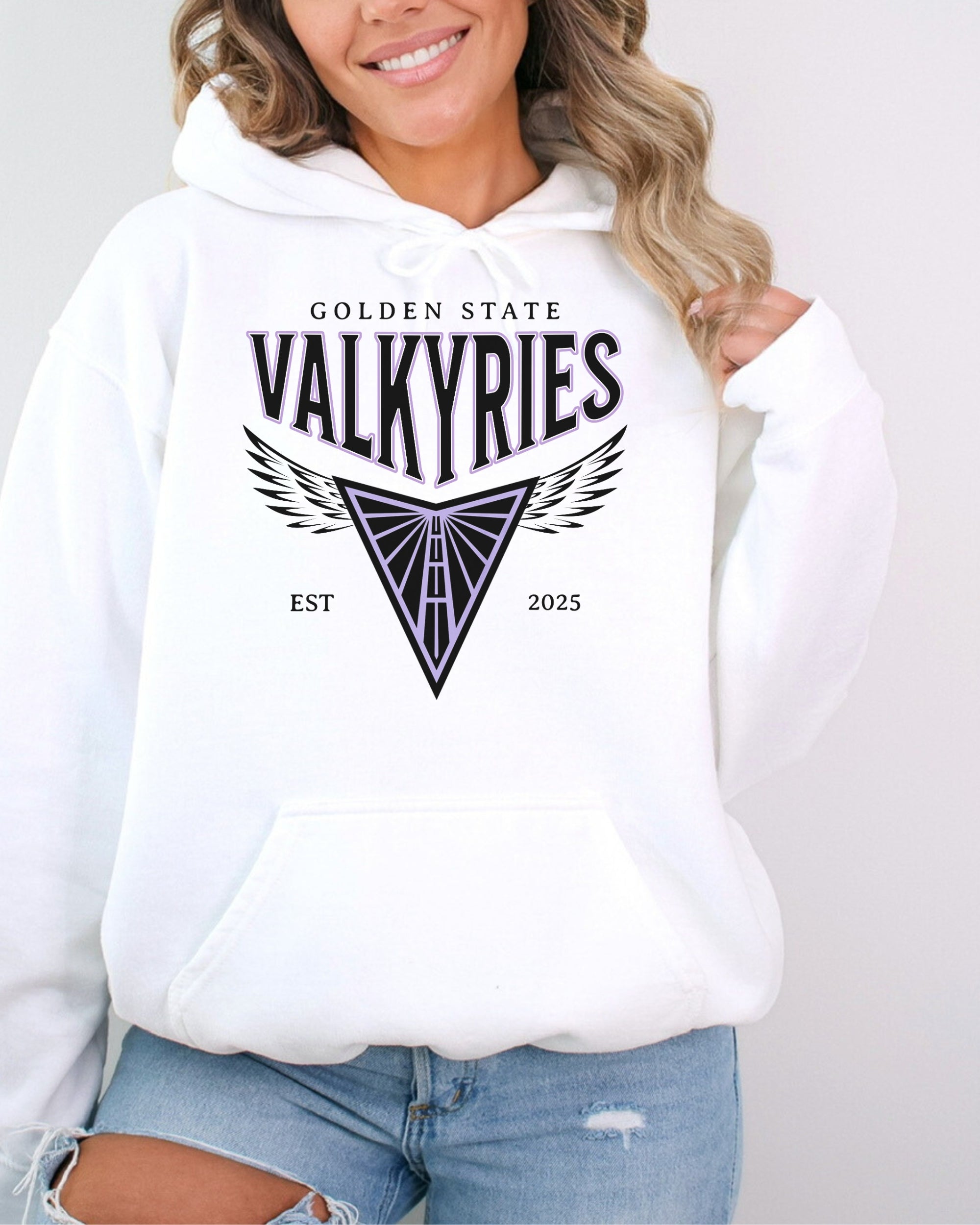 Person wearing a white hoodie with 'Golden State Valkyries' text and logo on a plain background
