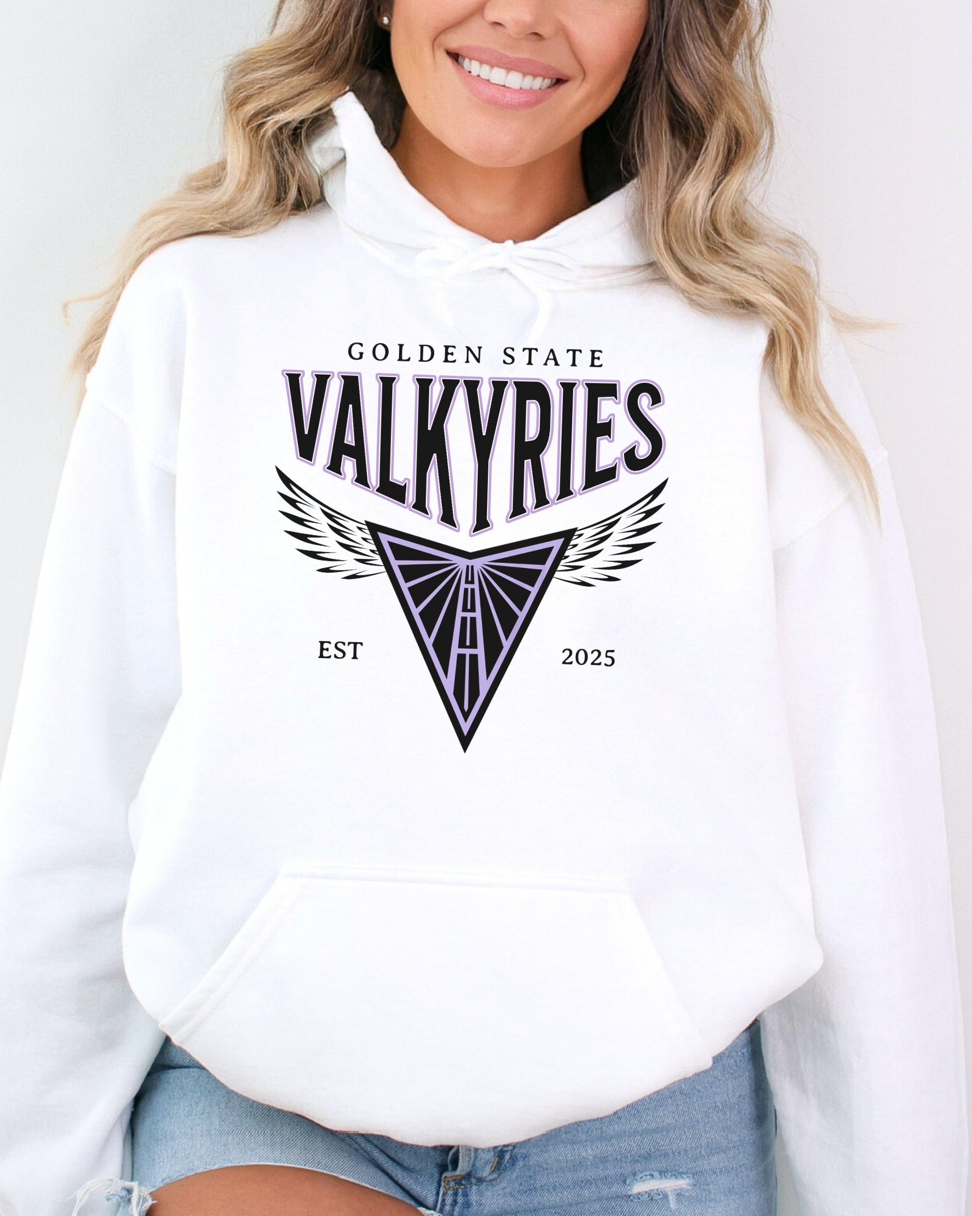 Person wearing a white hoodie with 'Golden State Valkyries' logo on a plain background