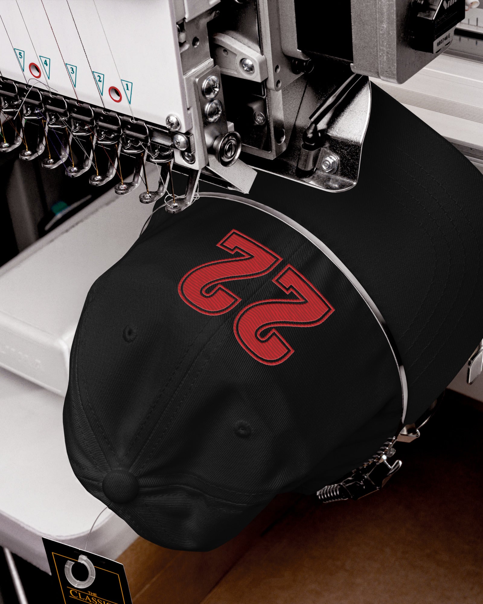 Black Caitlin Clark hat being embroidered with number 22