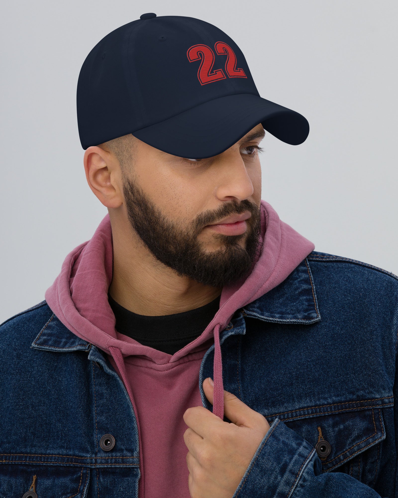 Man wearing navy number 22 dad hat