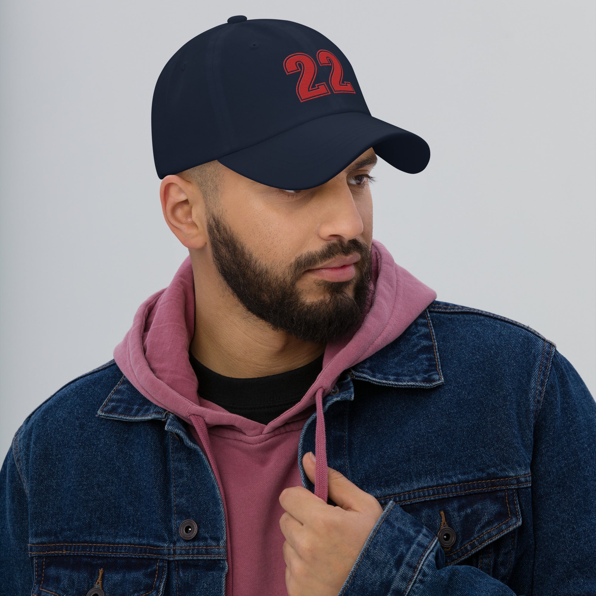 Man wearing navy number 22 dad hat