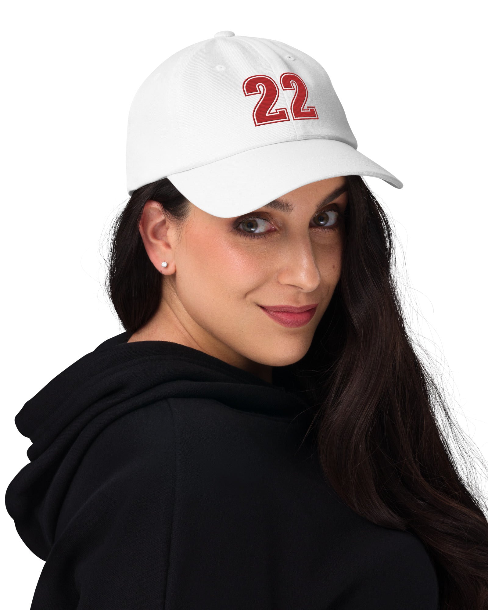 Girl wearing white number 22 dad hat