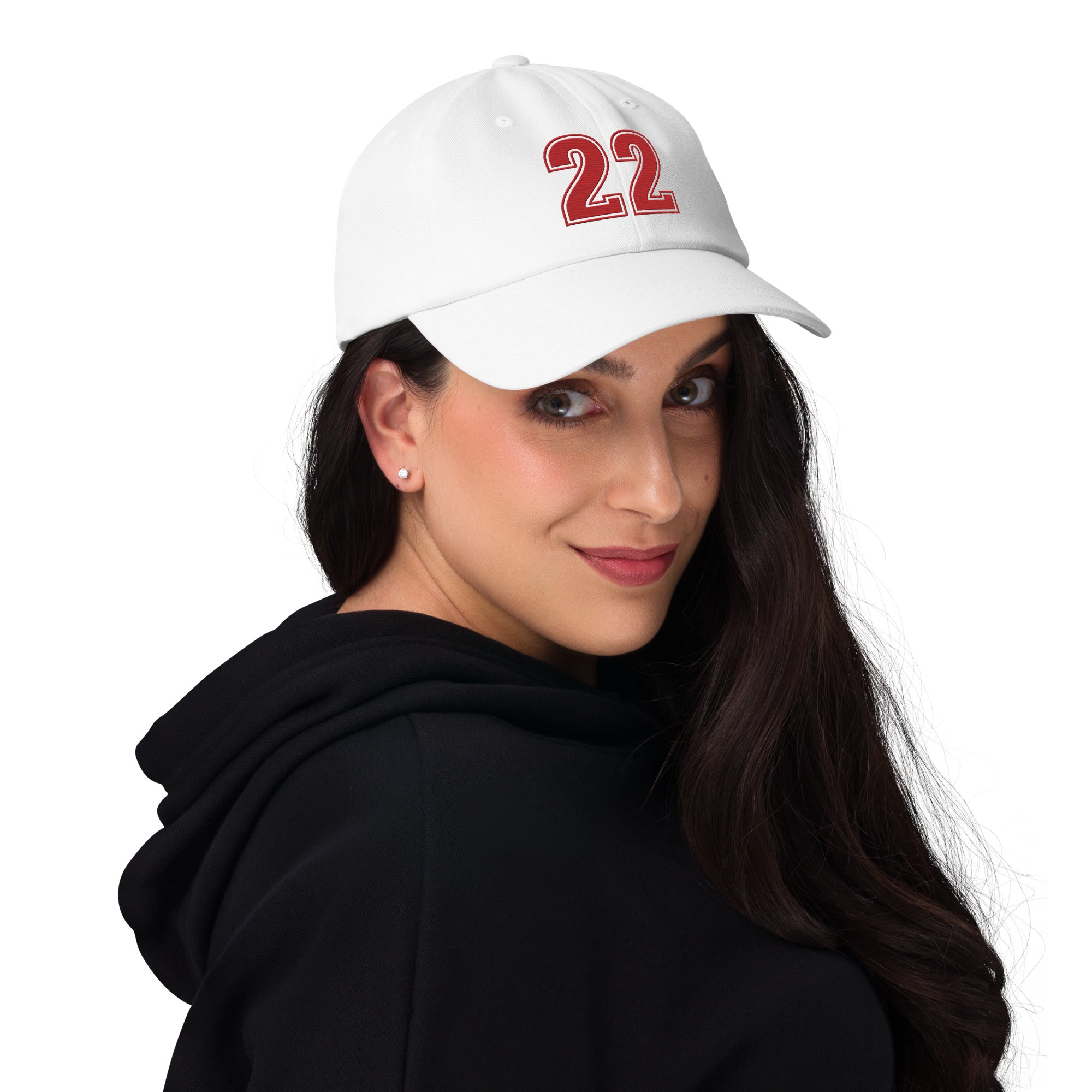 Girl wearing white number 22 dad hat