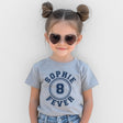 Child wearing a gray t-shirt with 'Sophie 8 Fever' design, heart-shaped sunglasses, and denim shorts against a light background.