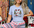 Girl wearing athletic heather t-shirt with snowman falling down saying fall risk