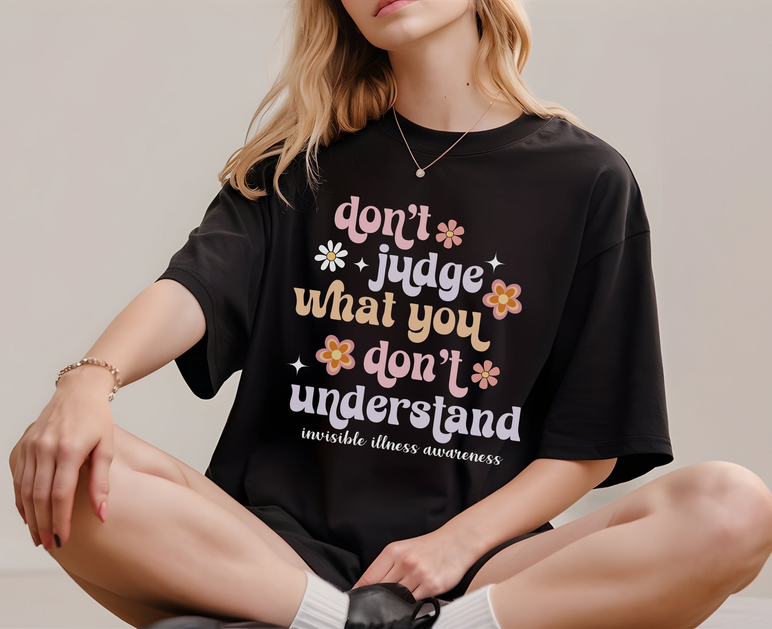 Girl wearing Comfort Colors invisible illness awareness shirt in black