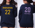 Girl wearing navy sweatshirt with Indiana 22 on front and Valkyries 20 on back