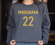 Girl wearing dark heather Indiana 22 Caitlin Clark sweatshirt