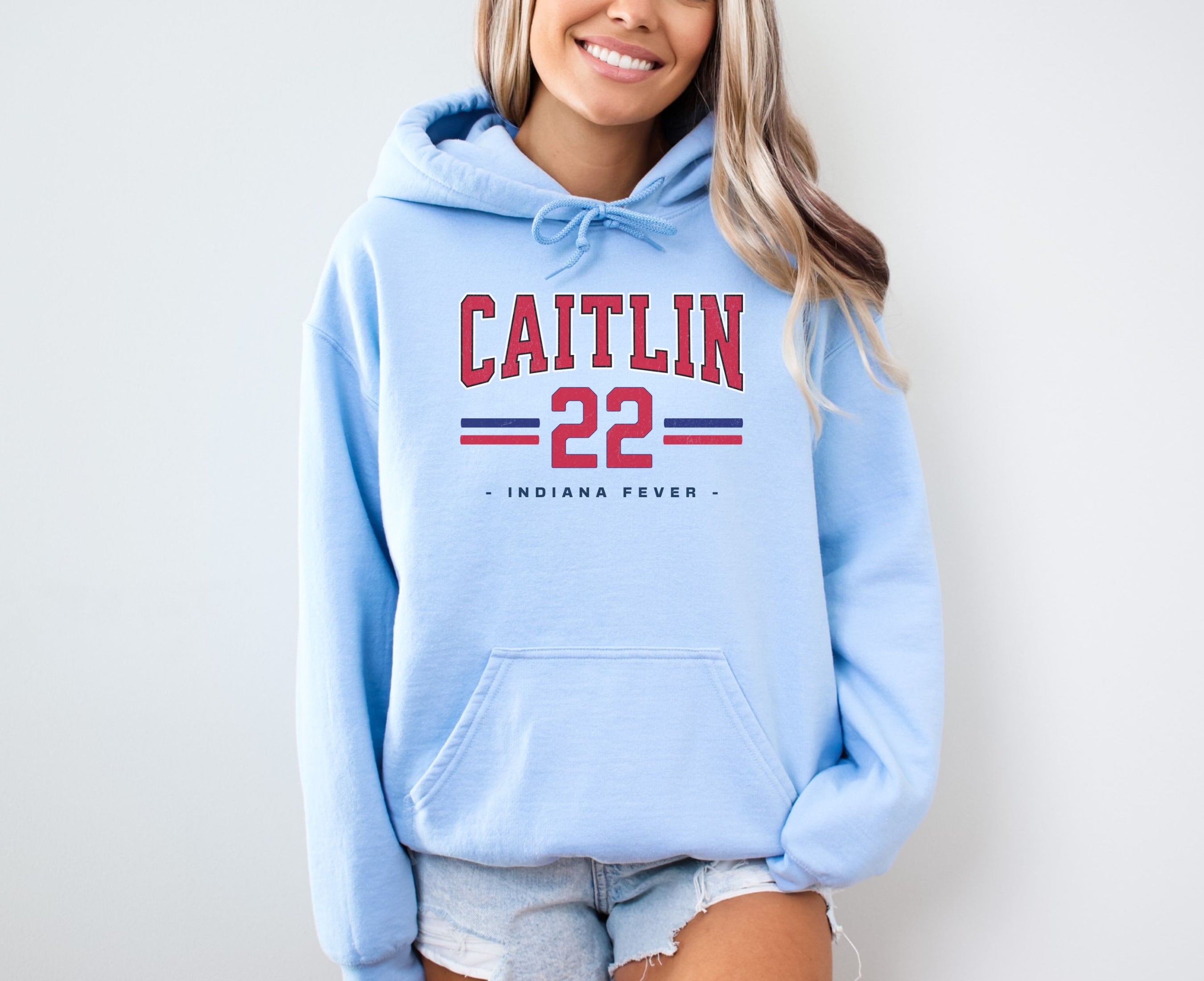 Girl wearing oversized light blue Caitlin Clark 22 Hoodie