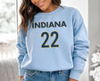 Girl wearing light blue Indiana 22 sweatshirt