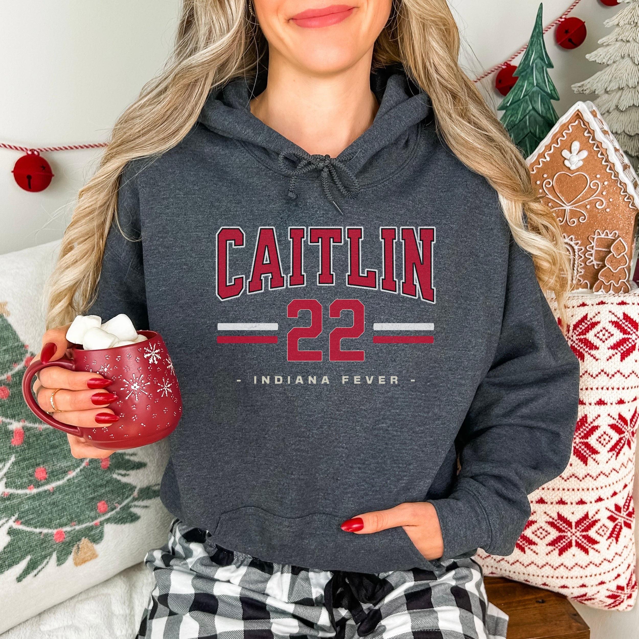 Woman wearing dark heather Caitlin Clark 22 Hoodie