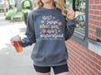 Girl wearing invisible illness Comfort Colors sweatshirt in pepper