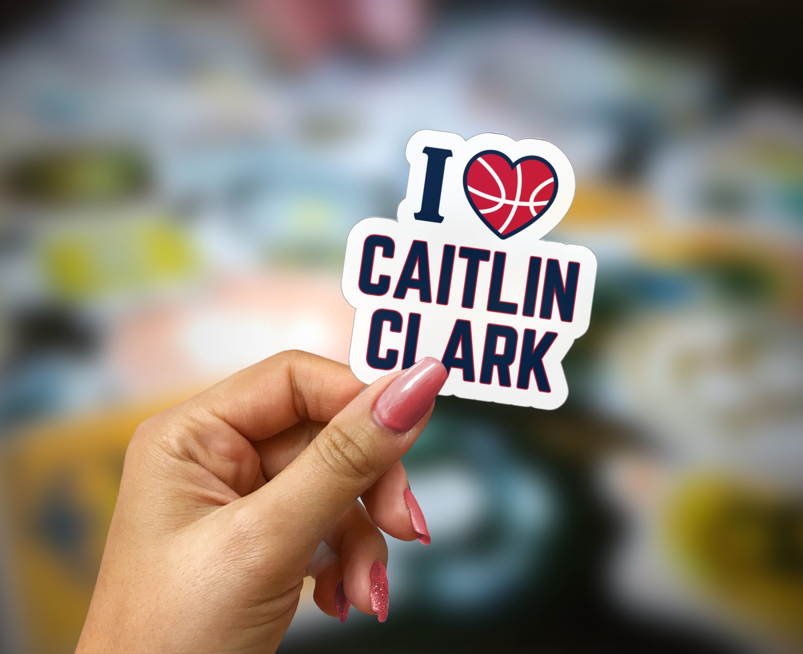 Person holding I love Caitlin Clark Sticker