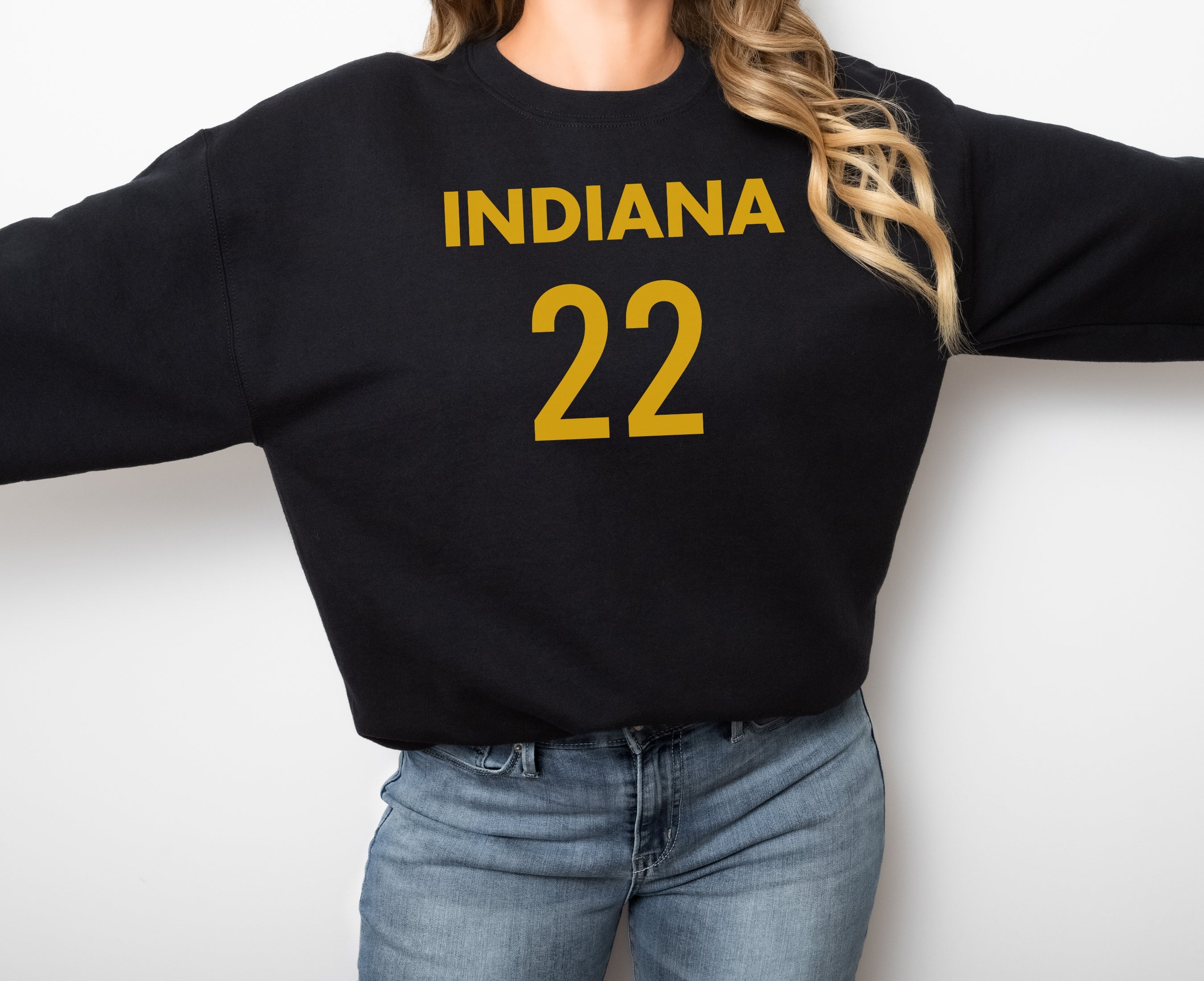 Girl wearing black Indiana 22 sweatshirt