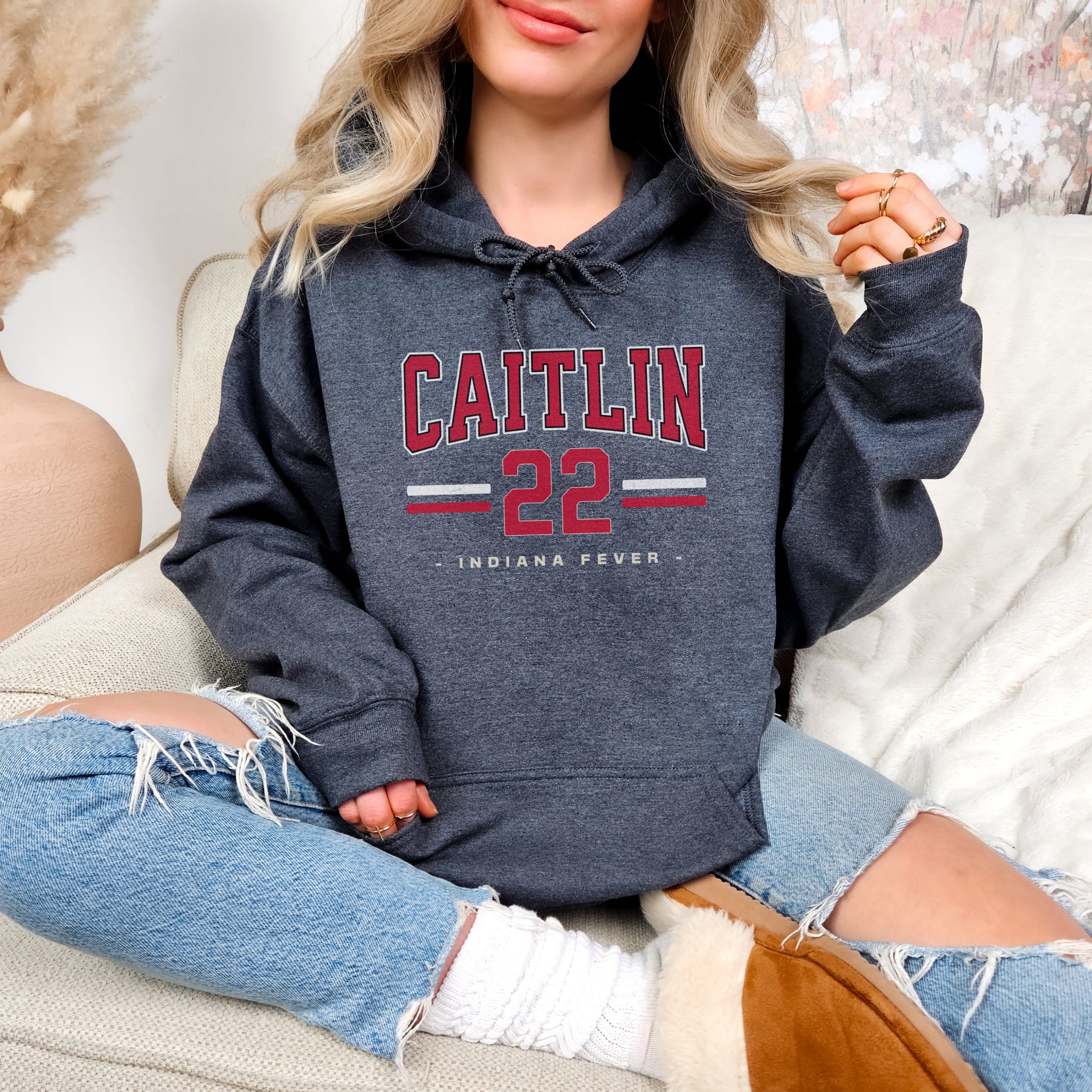 Woman wearing dark heather Caitlin Clark 22 Hoodie
