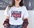 Woman wearing white Caitlin Clark Fever t-shirt