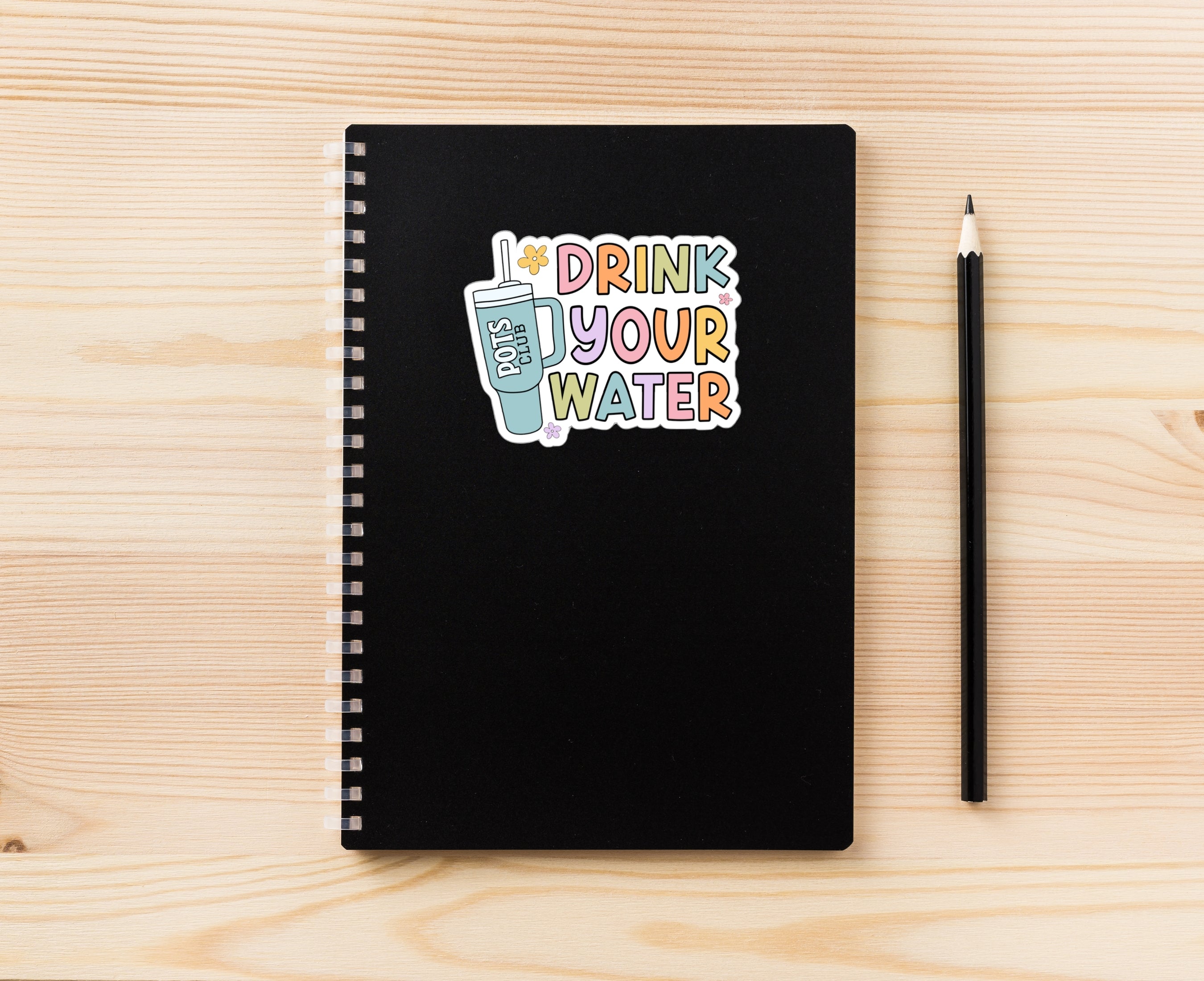 Drink your water sticker on notebook