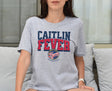 Woman wearing Athletic Heather Caitlin Fever shirt