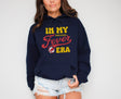 Woman wearing navy in my Fever era hoodie