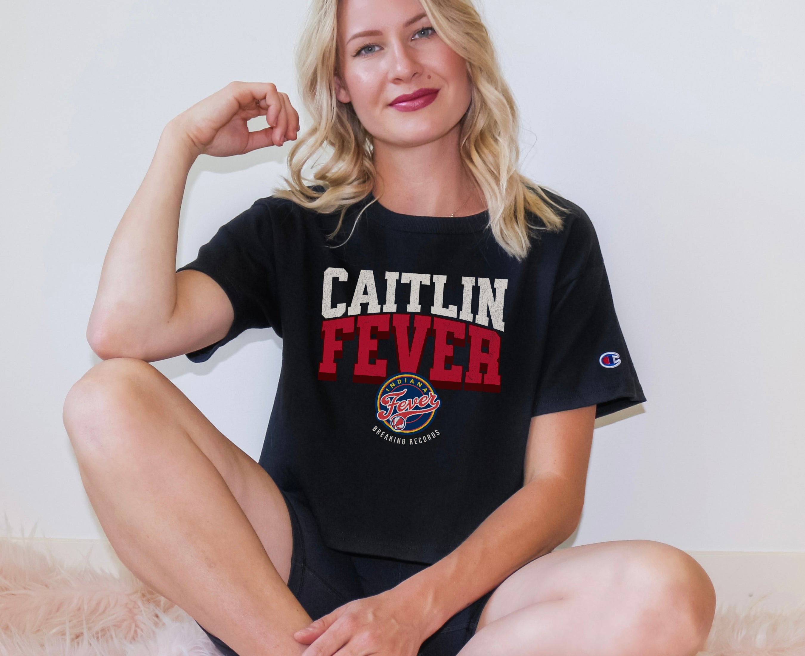 Girl wearing black Caitlin Clark Fever Crop Top