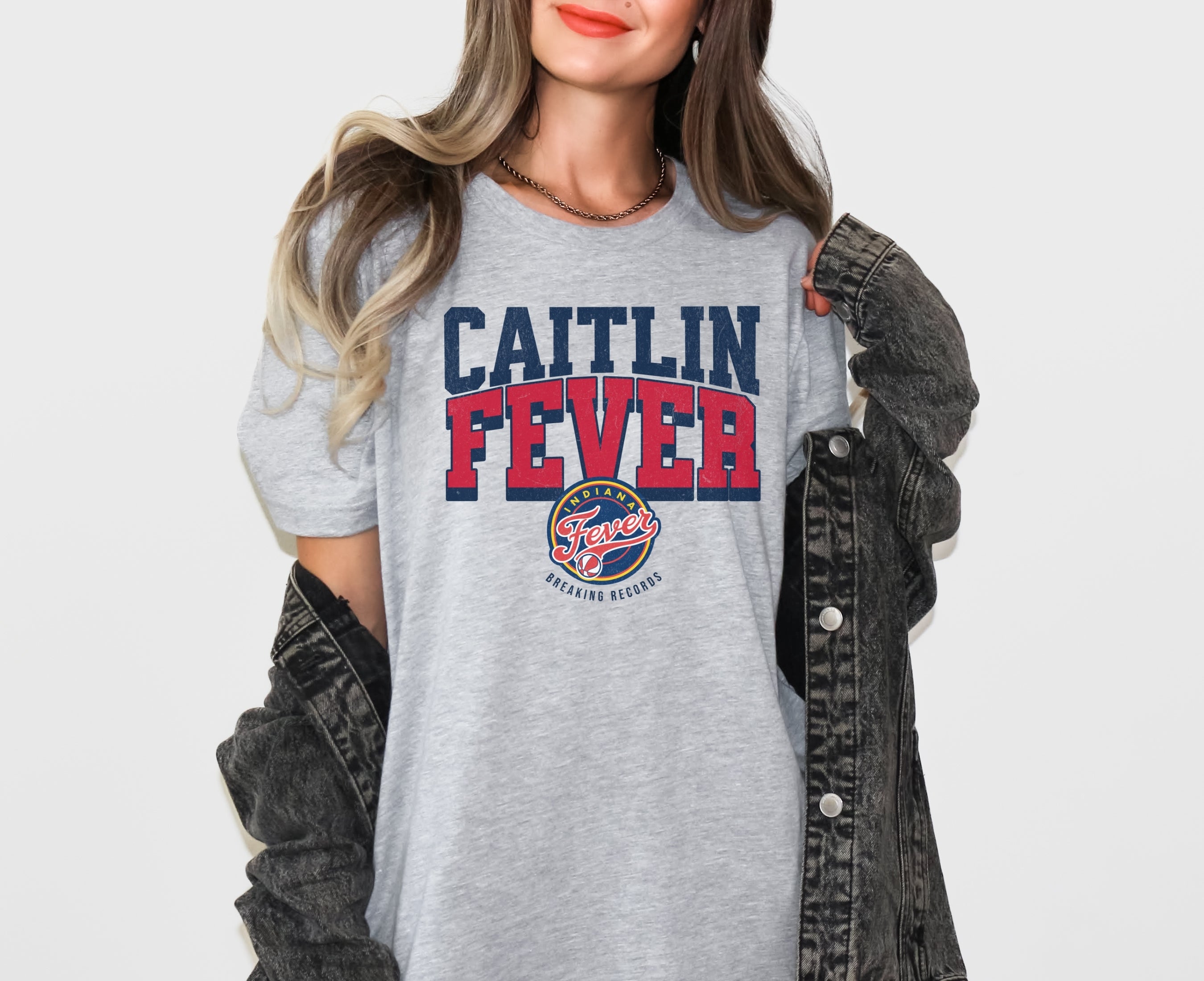 Girl wearing Athletic Heather Caitlin Fever shirt